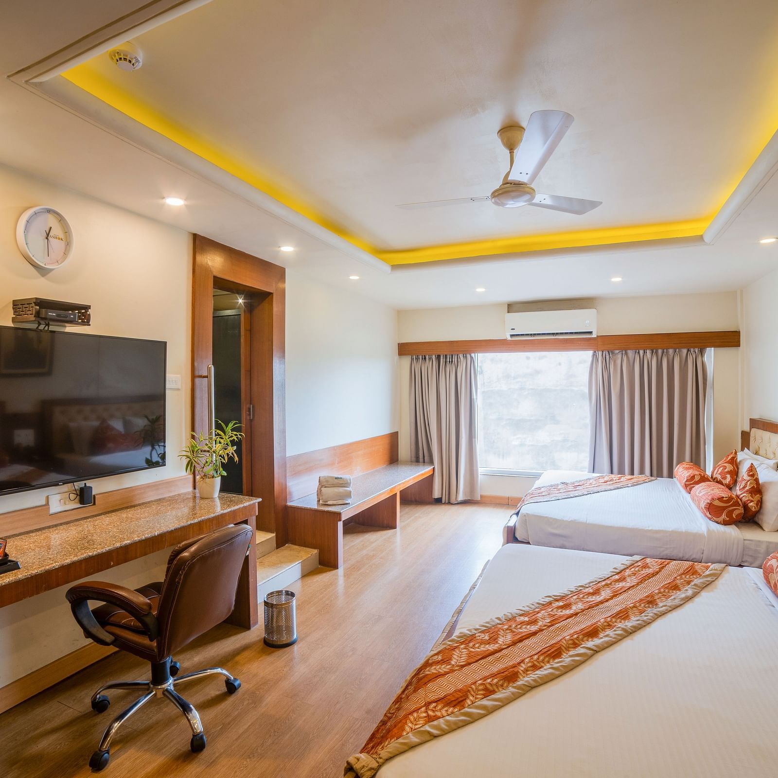 Family Room featuring two lare beds with interior decor. - Hotel Ashok Nagpur