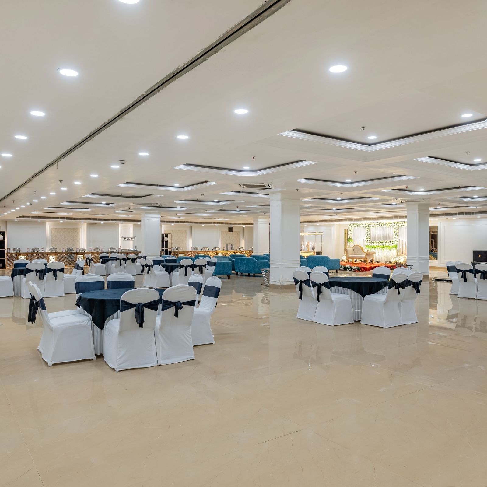 Banquet hall with cluster seating arrangement and open space ideal for social gatherings at Hotel Highway King, Bilaspur.