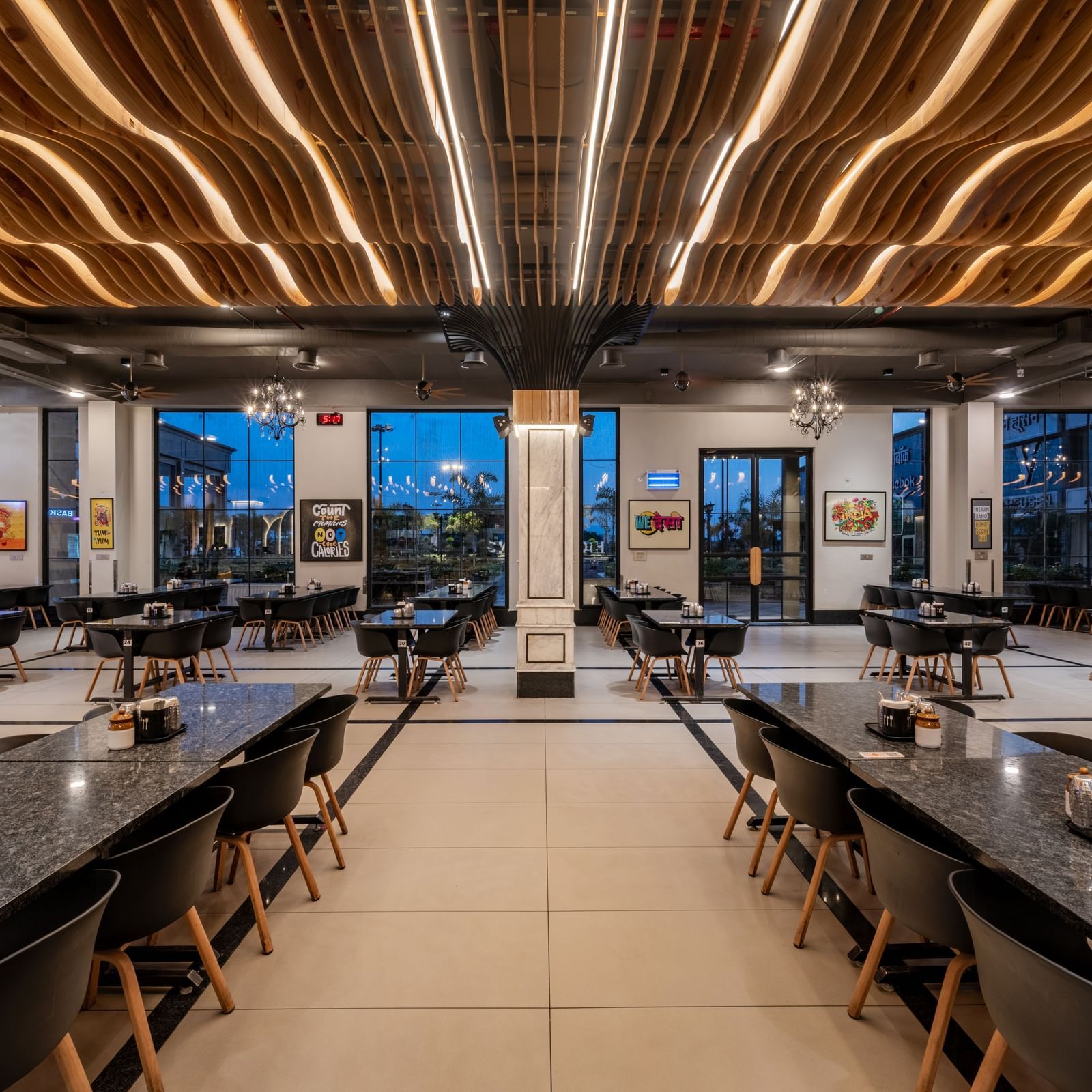 A broad capture of the dining hall at Hotel Highway King, Kishangarh, displaying the spacious layout and modern decor.