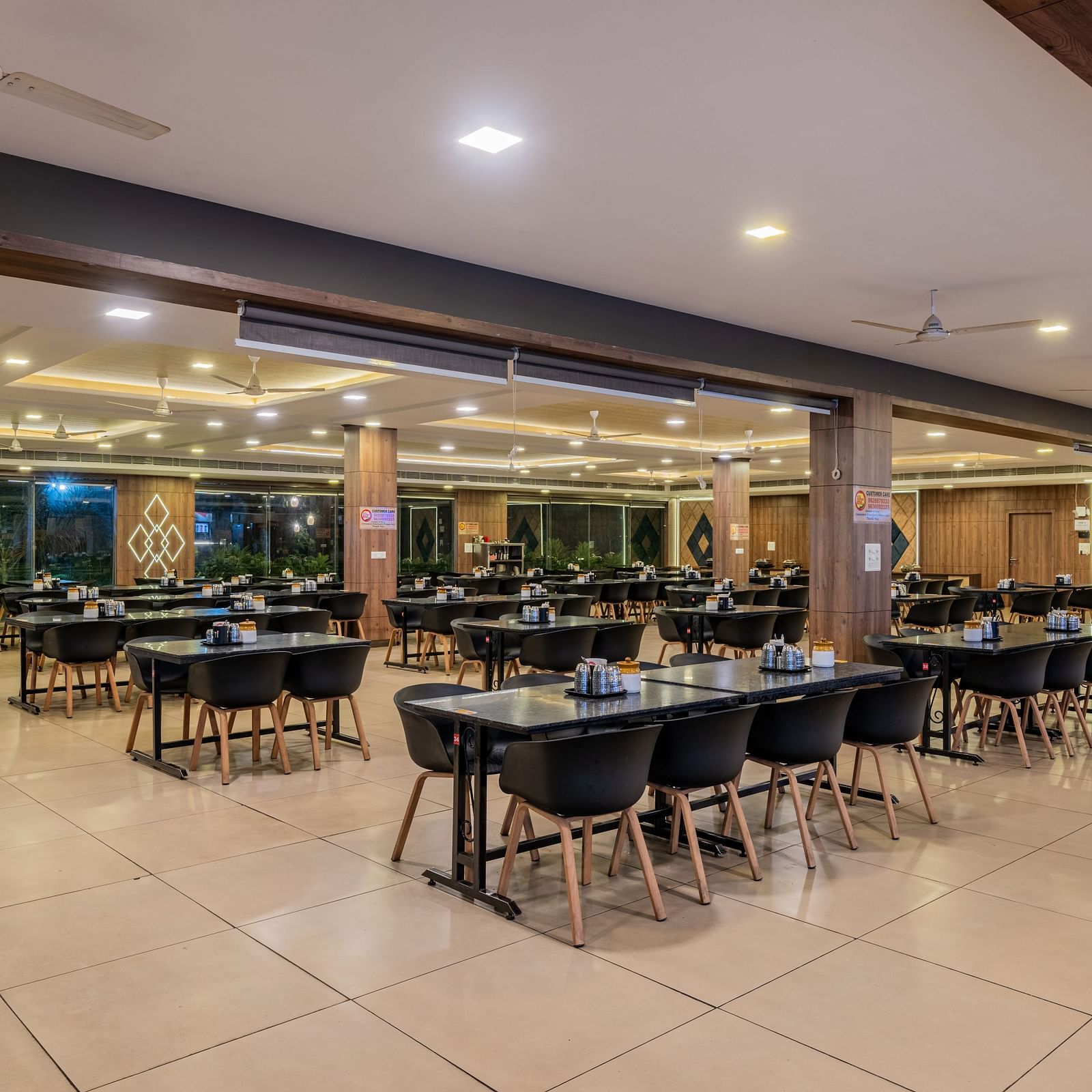 Another view of the spacious and empty restaurant dining area at Hotel Highway King Shahpura.
