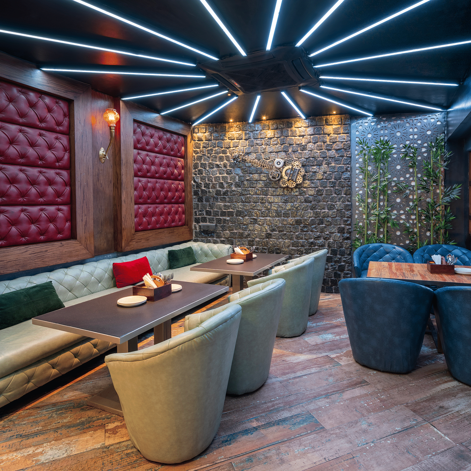 Interior view of the restaurant at Hotel Moti Palace, featuring comfy sofas and warm, ambient lighting