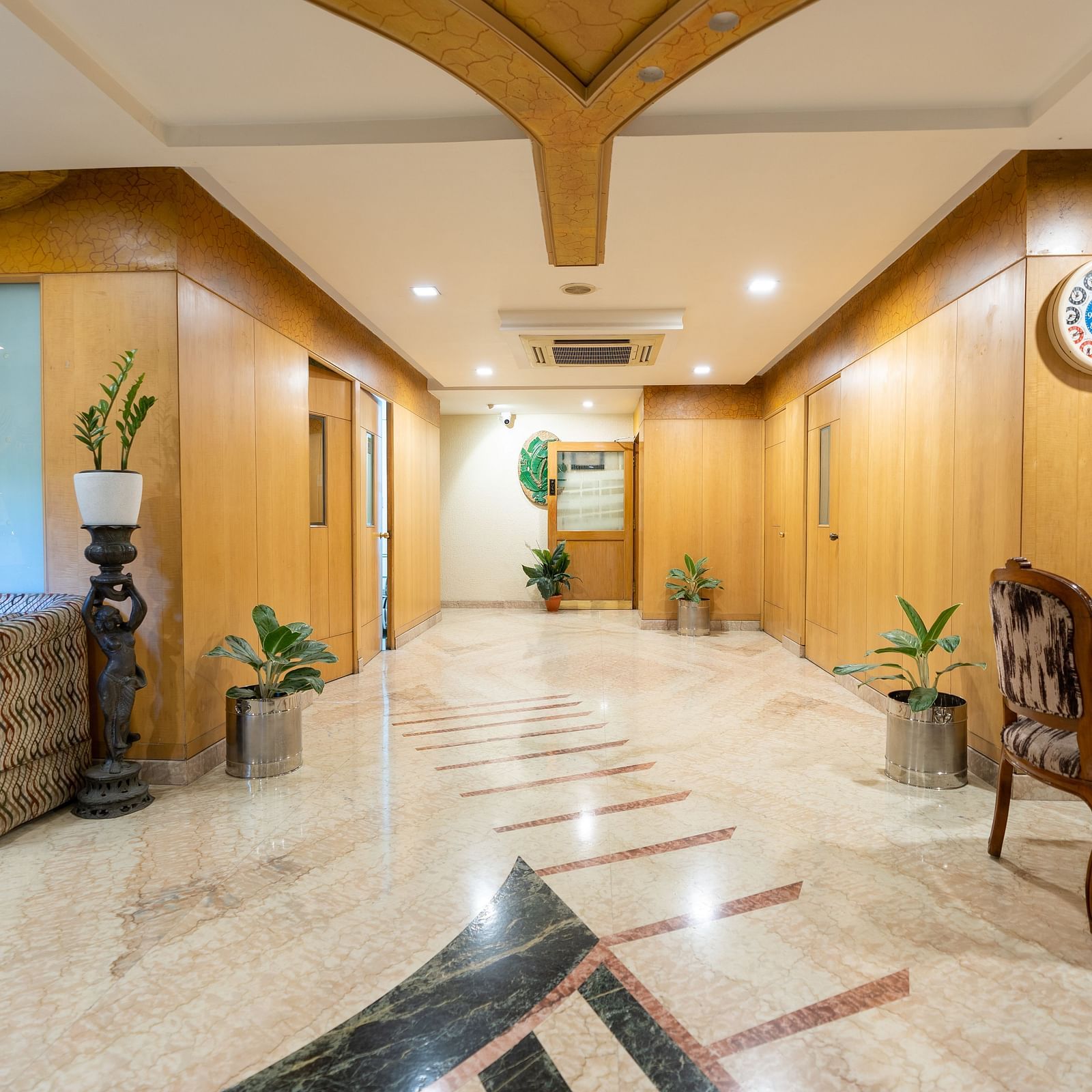 Overview of the lobby with seating arrangements - Hotel Pai Comforts, JP Nagar