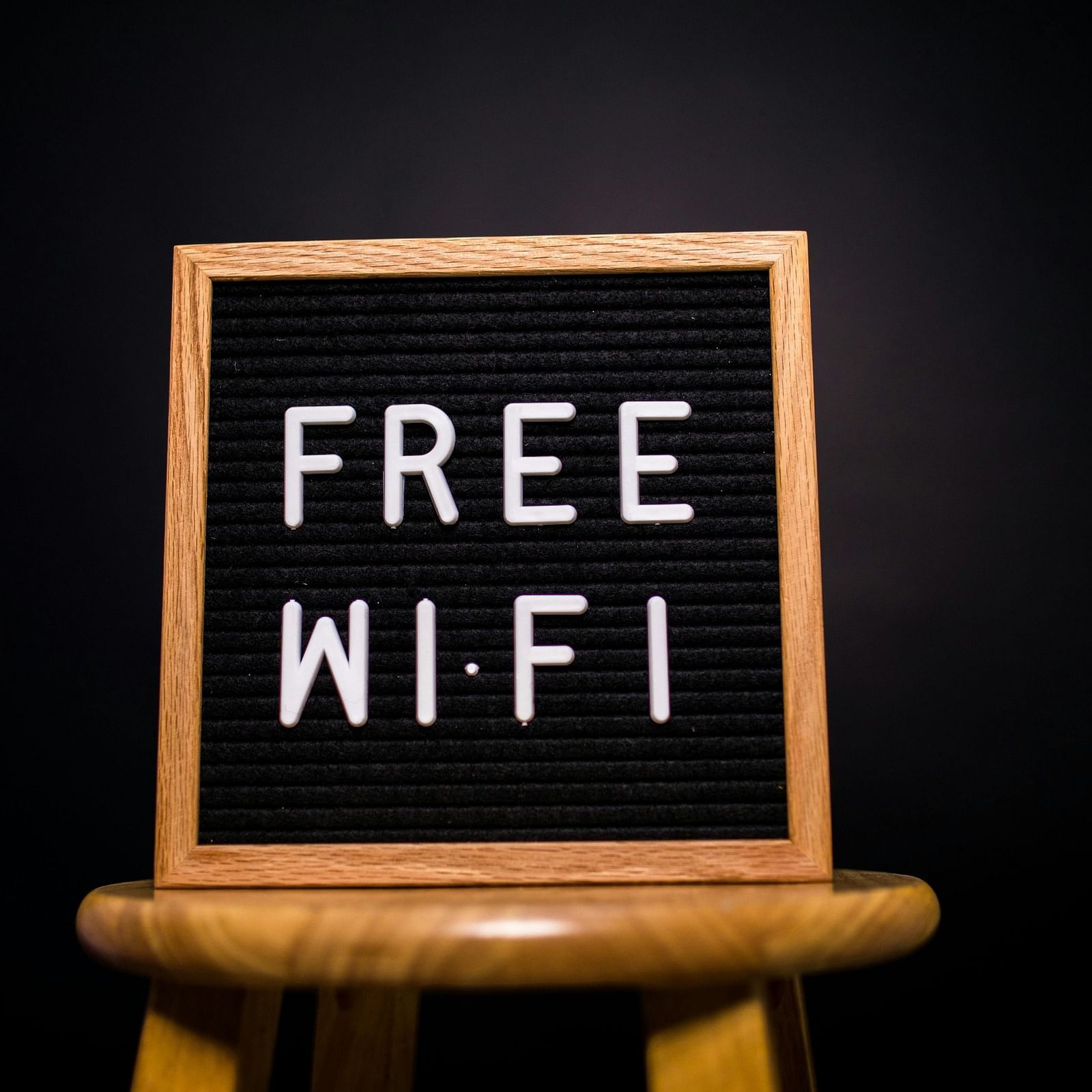 a board that says free wifi