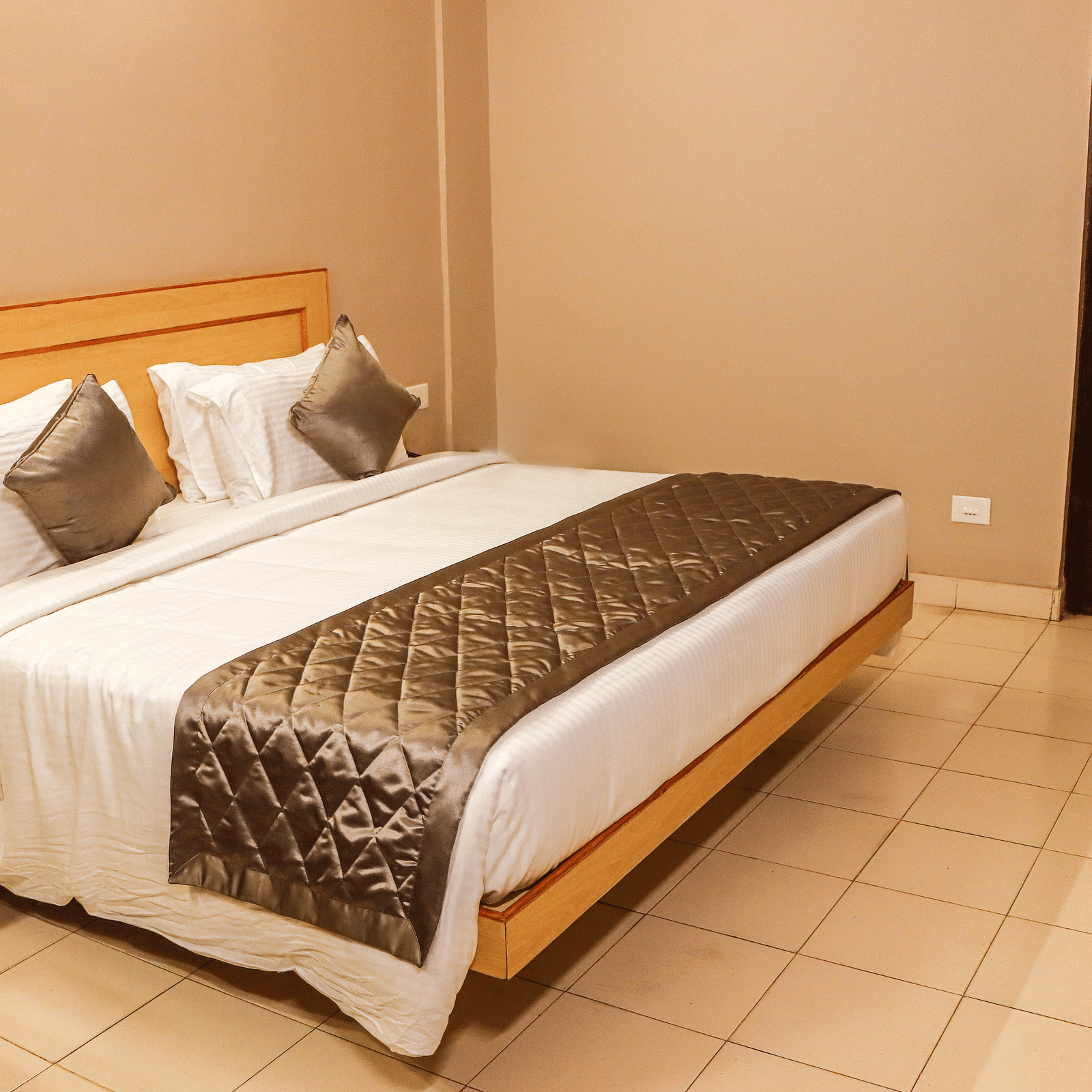 view of king size bed of a Deluxe Room at at Hotel Vinayaga, Tiruppur