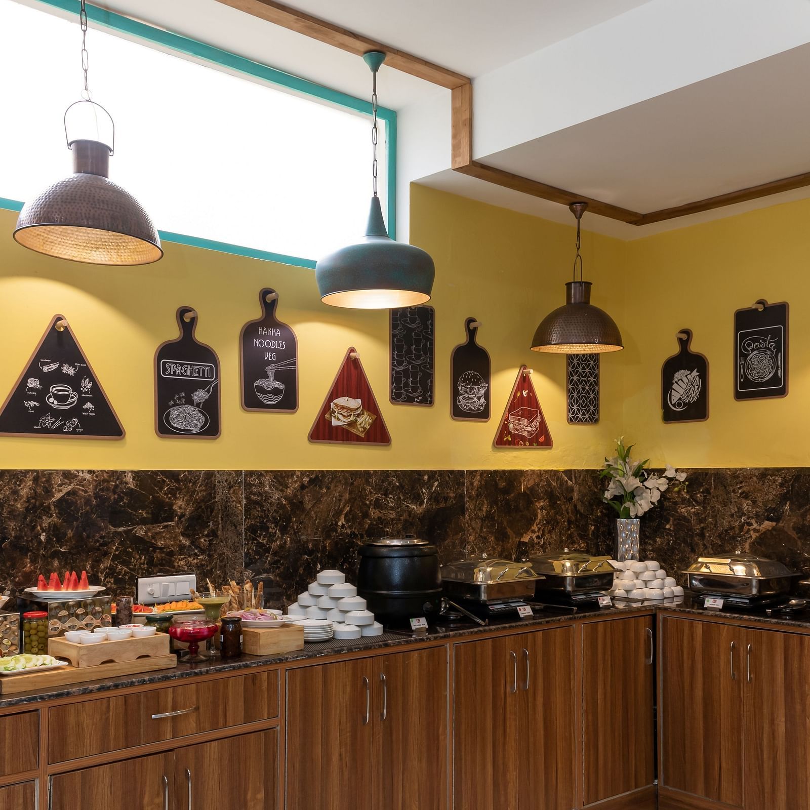 A colourful buffet display, featuring a variety of dishes in a contemporary restaurant setting | Inde Hotel Cyber City 