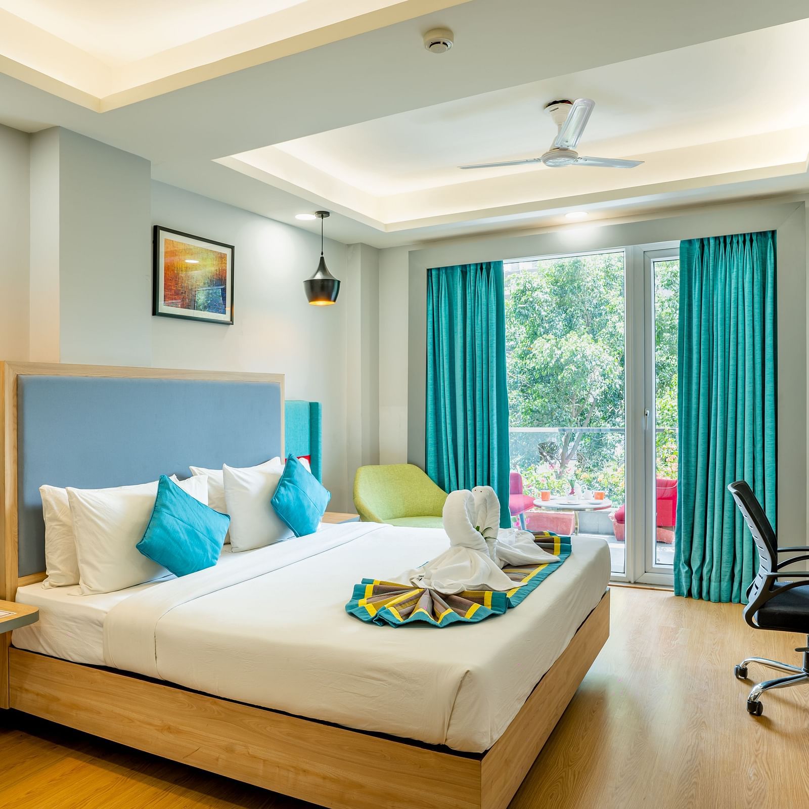 An image of a bedroom with balcony | Inde Hotel Golf Course Extension