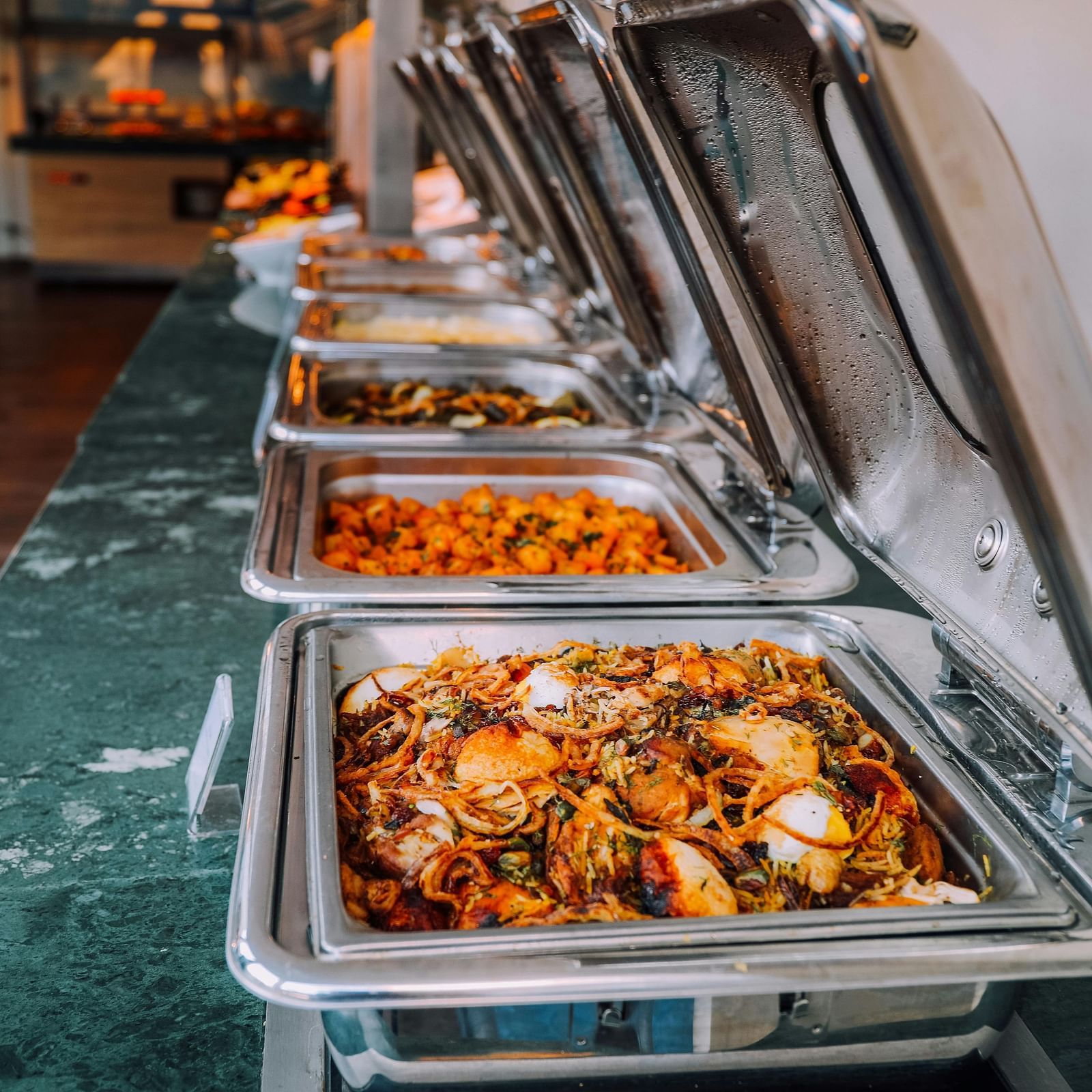 An image of a buffet | Inde Hotel Golf Course Extension