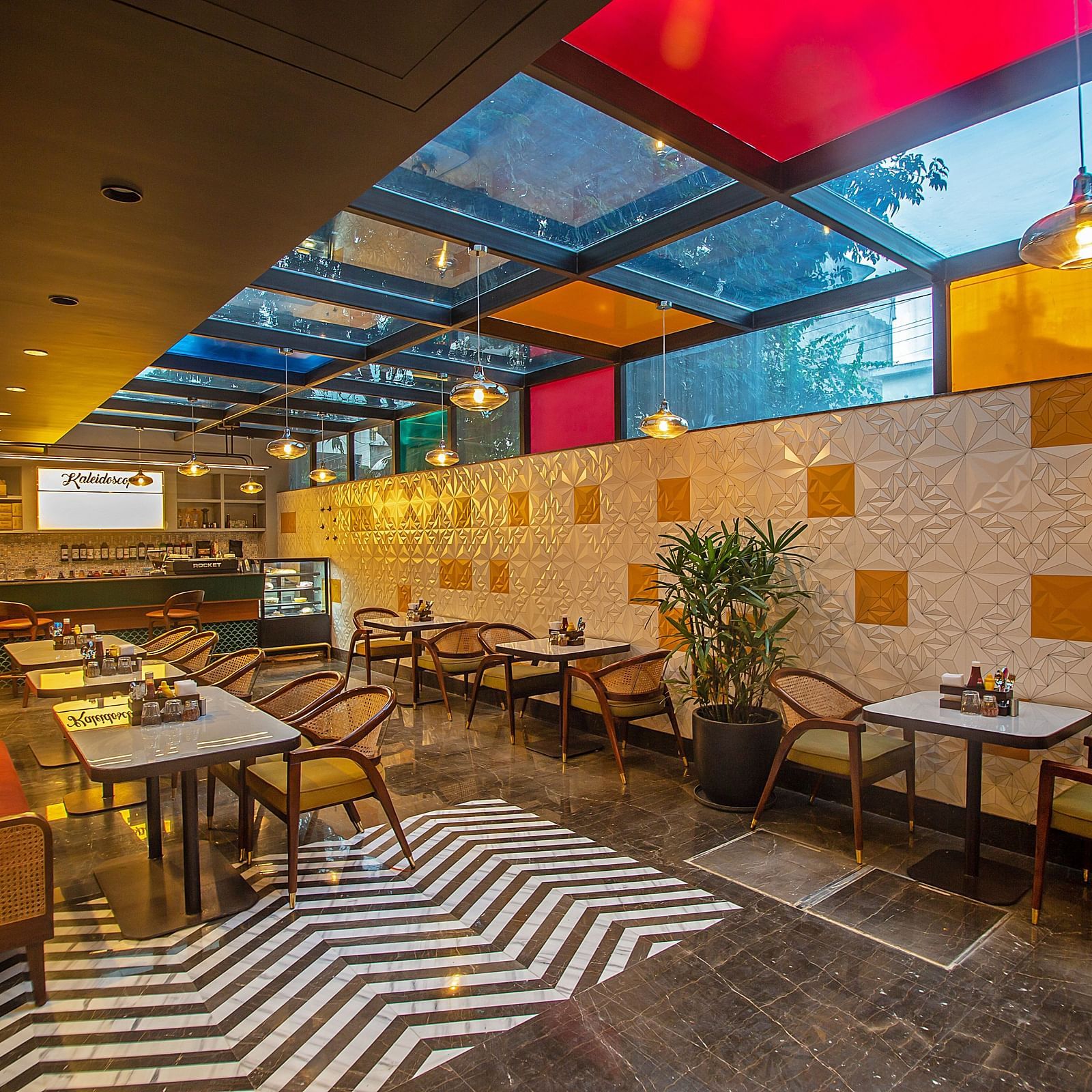An image of a dining area with various seating arrangements including chairs, table, and sofa 