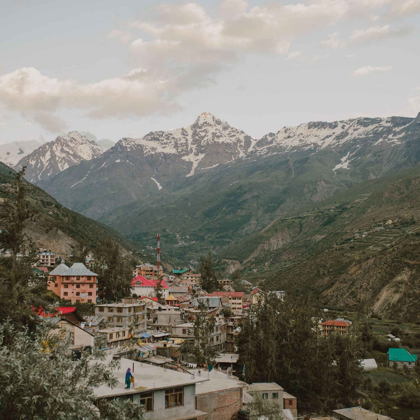 Sub-aerial view of a mountain town during dry season and on a cloudy day