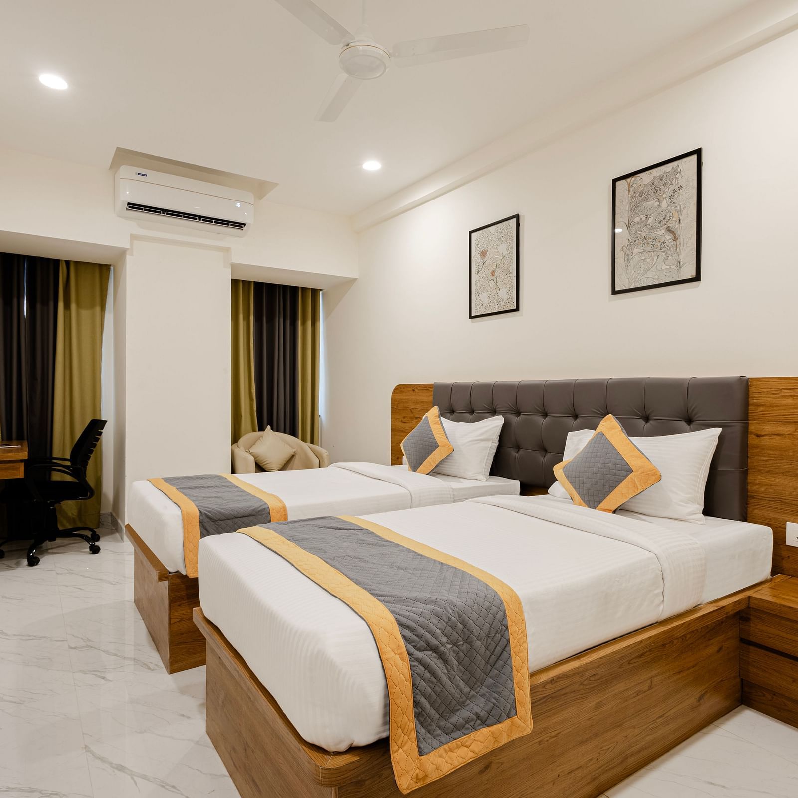 Stylish cosy twin room with twin beds and warm lighting at Lemonridge Hotels, IDPL Balanagar
