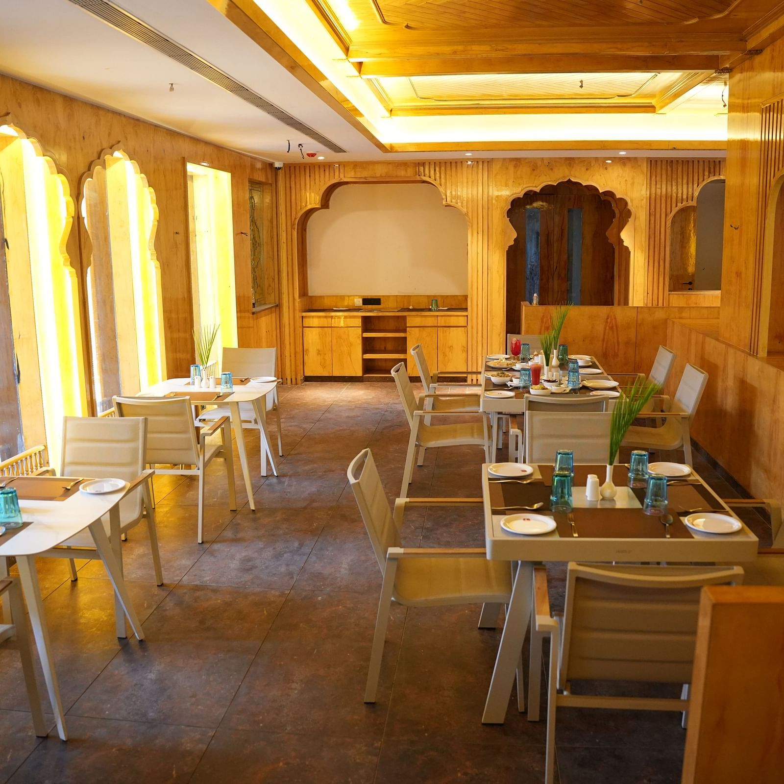 a wooden themed restaurant seating arrangements at Lords Hrim Resort Basar 