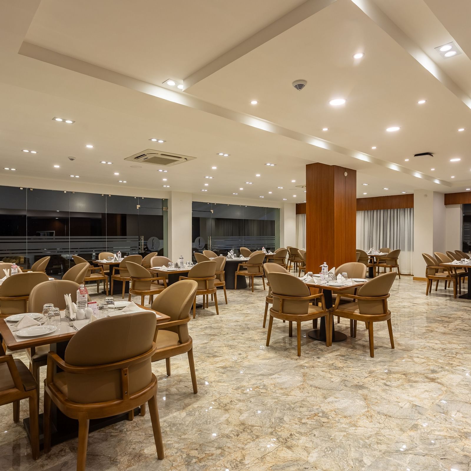 The Blue Coriander restaurant at Mandala Norling Lords Prime in Kathmandu featuring a fine dining seating arrangement and well-placed cutlery.