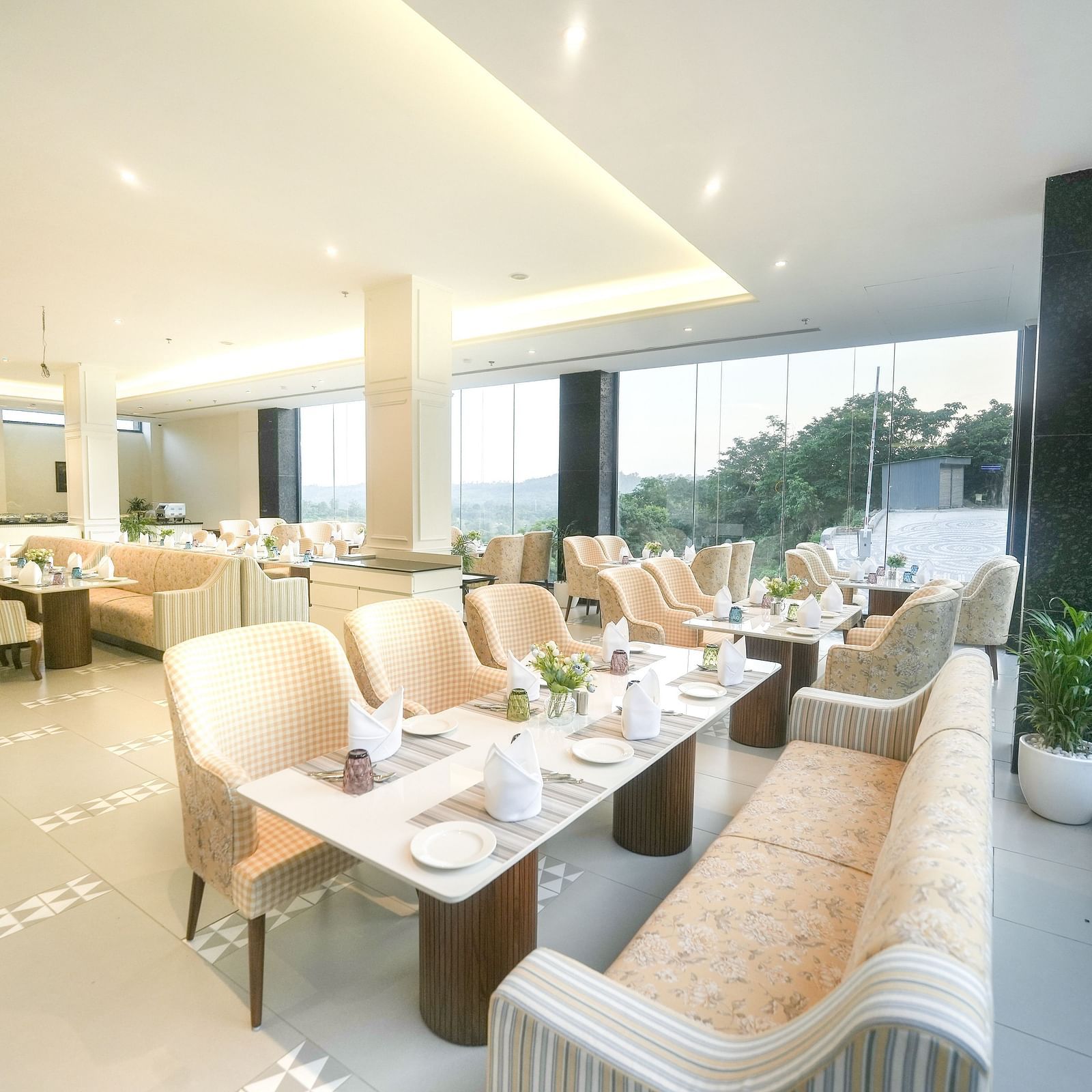 An image of a restaurant with tiled flooring, cosy furniture, and dining tables near a floor-to-ceiling window - NAMAMI BY ZENQ BANKHANDI