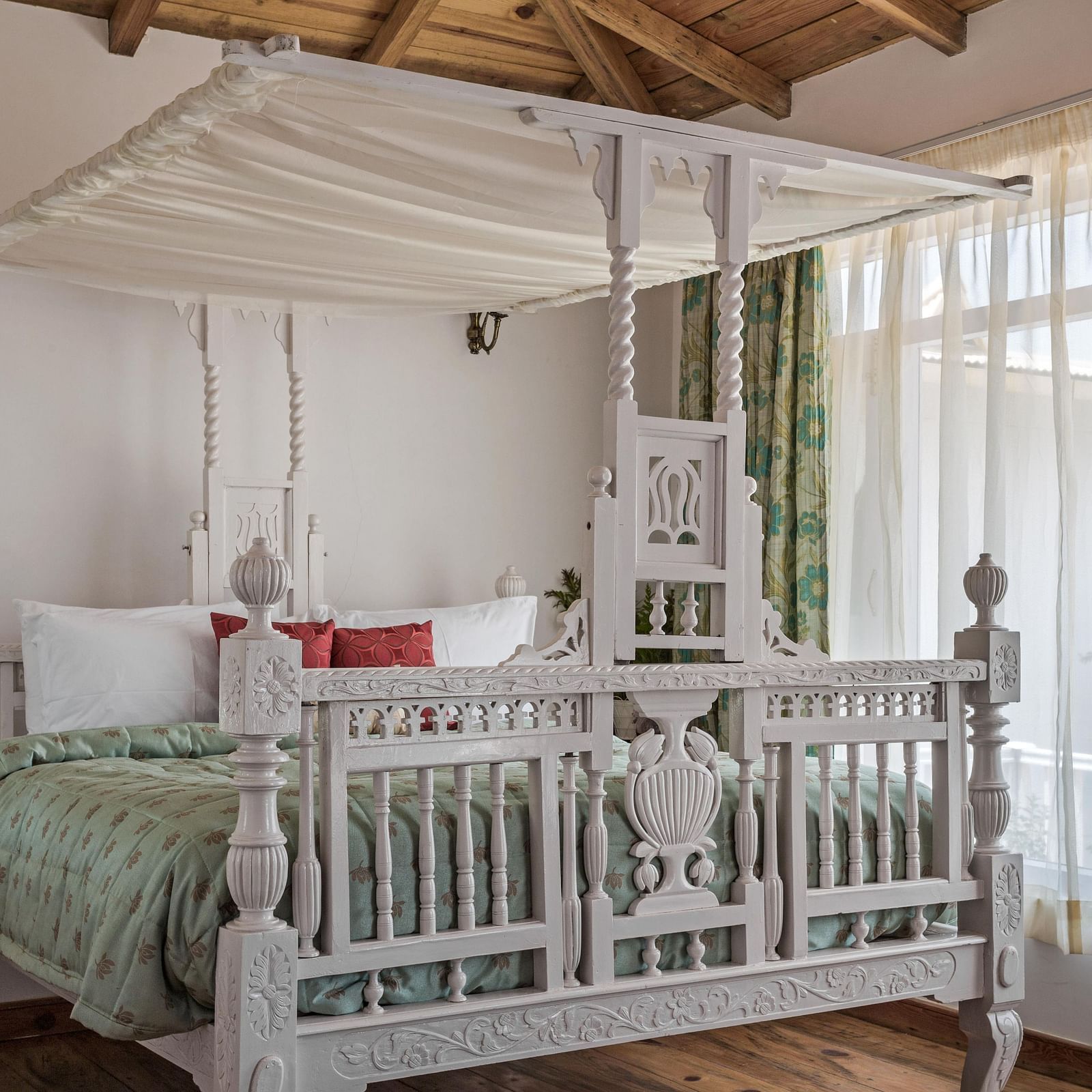 The close view of the bedroom with cosy bed and ambience and an wide window with a beautiful view at Te Aroha by Shervani, Mukteshwar