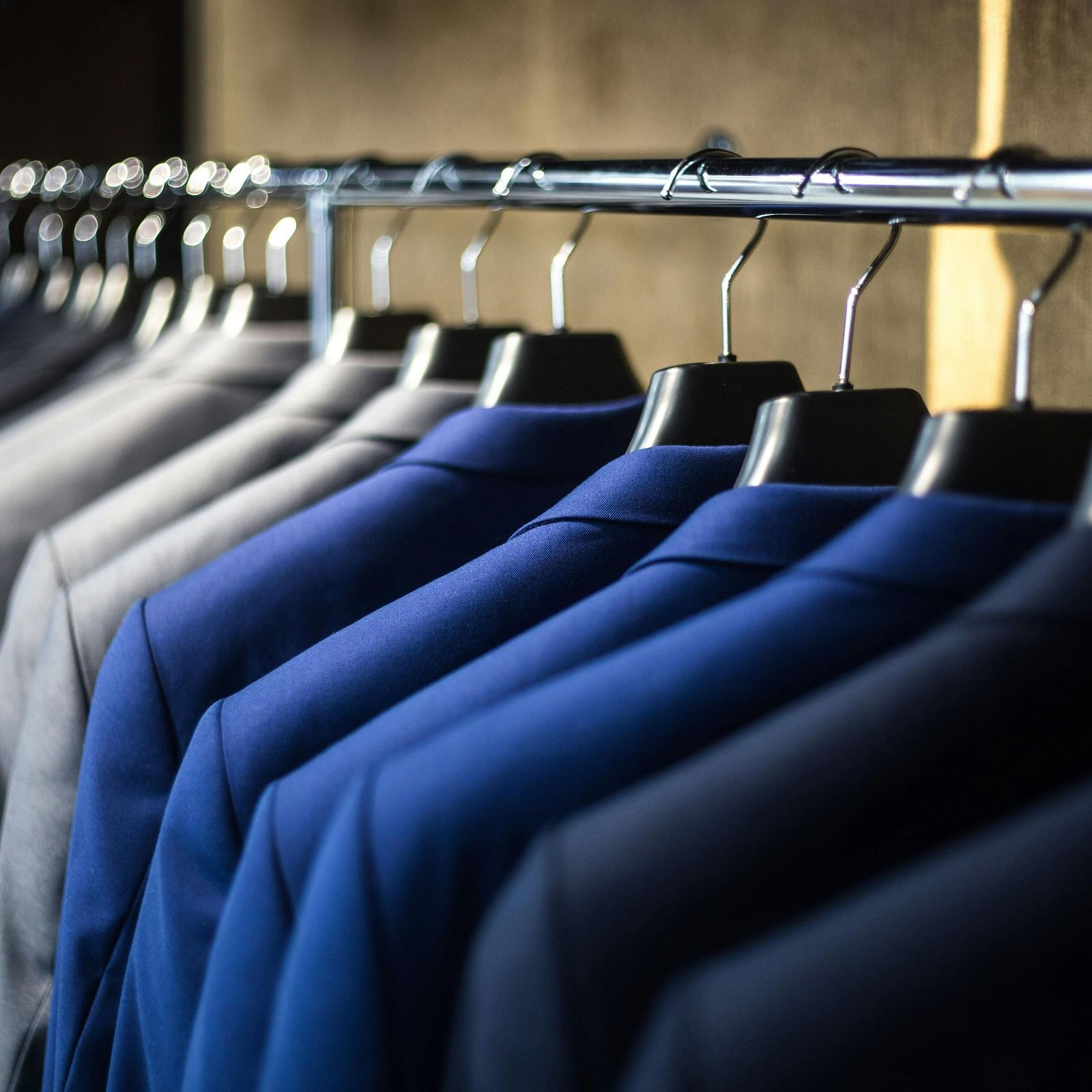 Suit jackets hanging in a cupboard