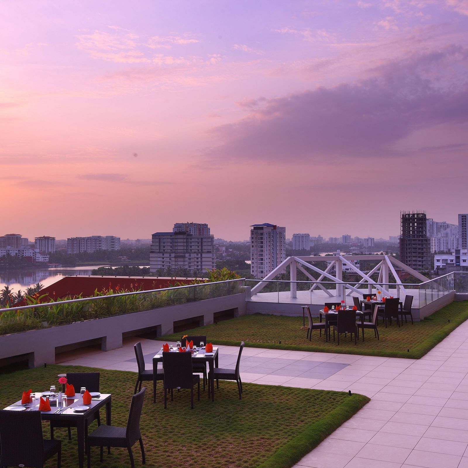 Seating arrangement inside the Terrace Garden in the evening - Starlit Suites, Kochi