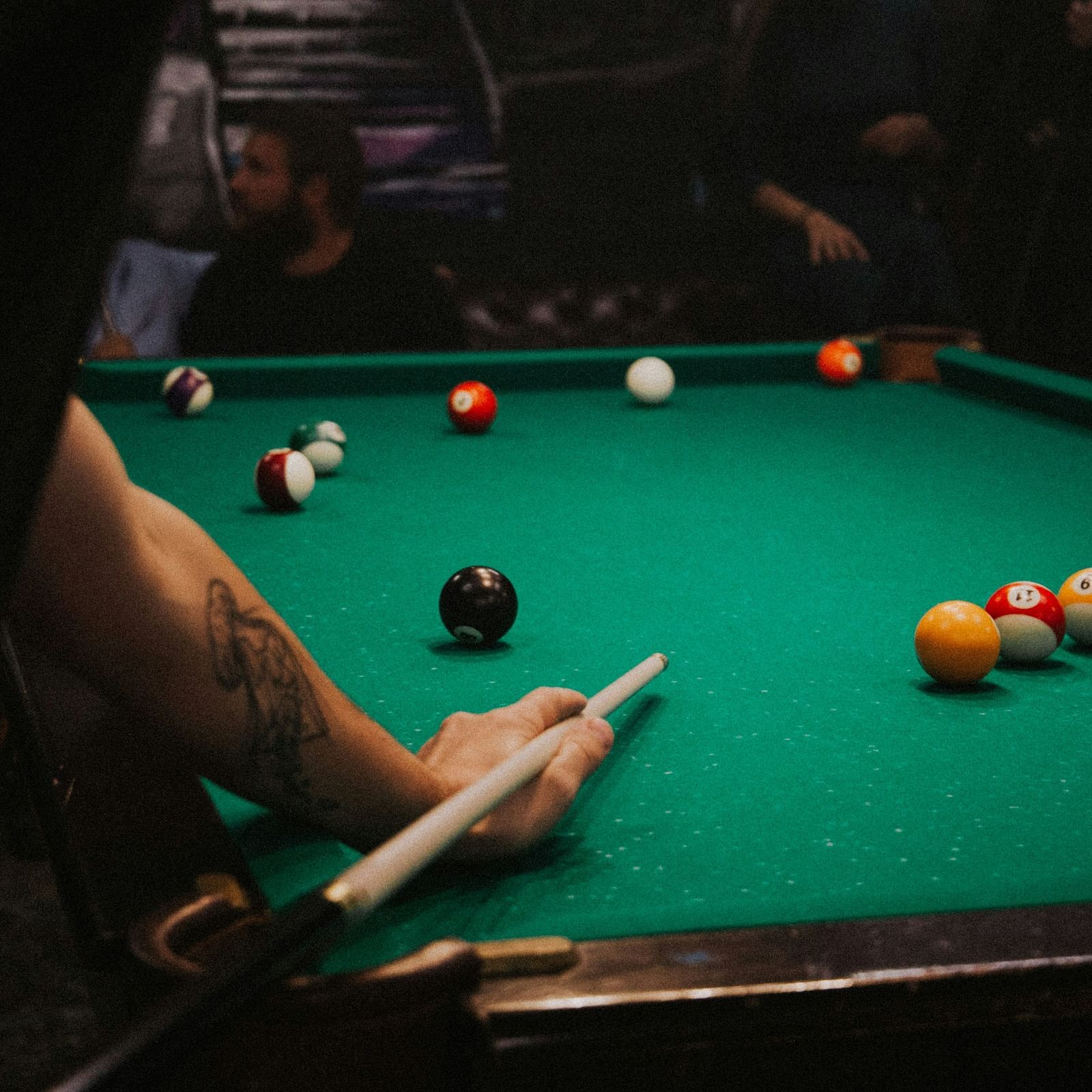 a person playing pool