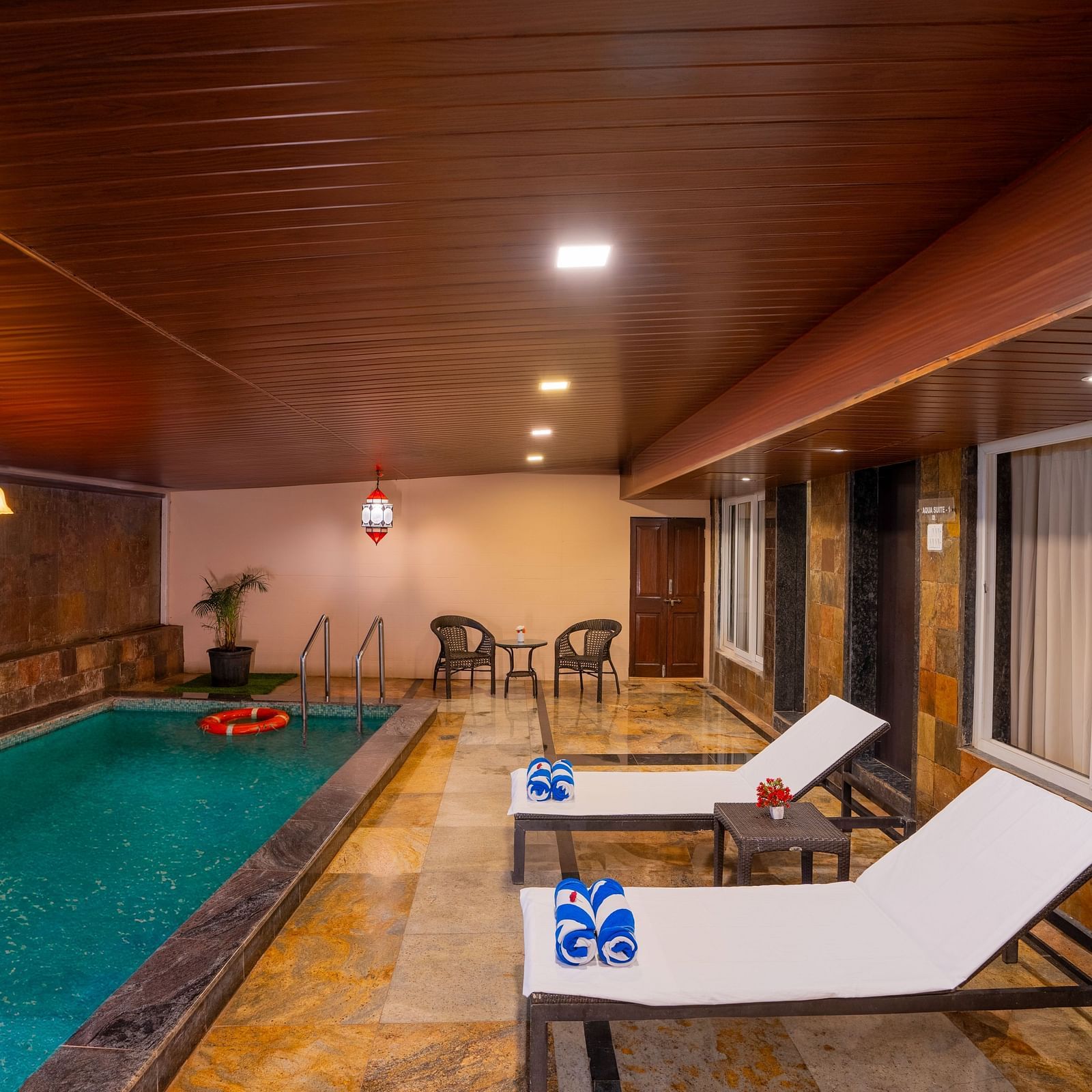 image of a private swimming pool at the resort with two lounge chairs | The Grand Legacy Resort and Spa