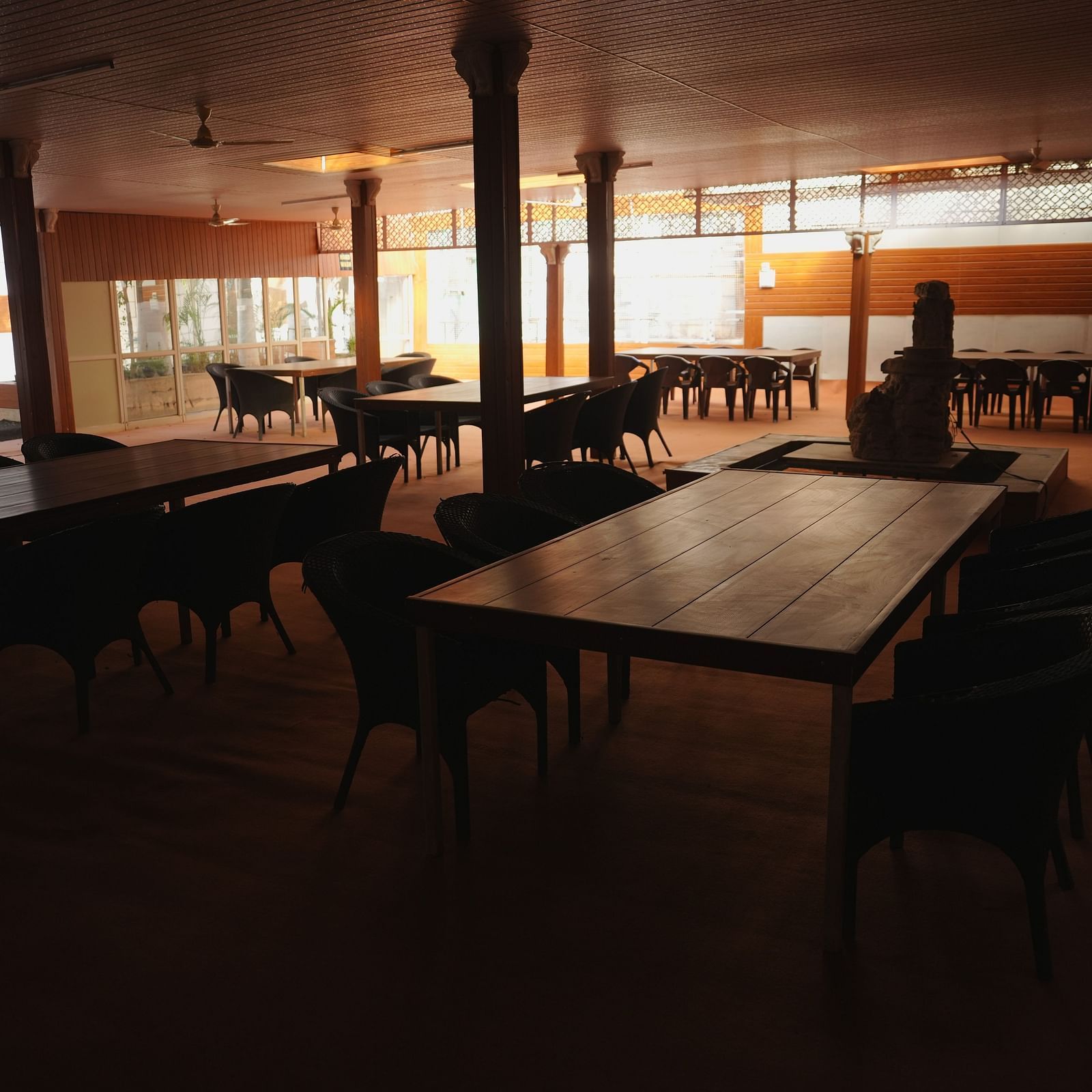A dining seating area at The Meenakshi Resort by Welcome Inn Hospitality, Bangalore.