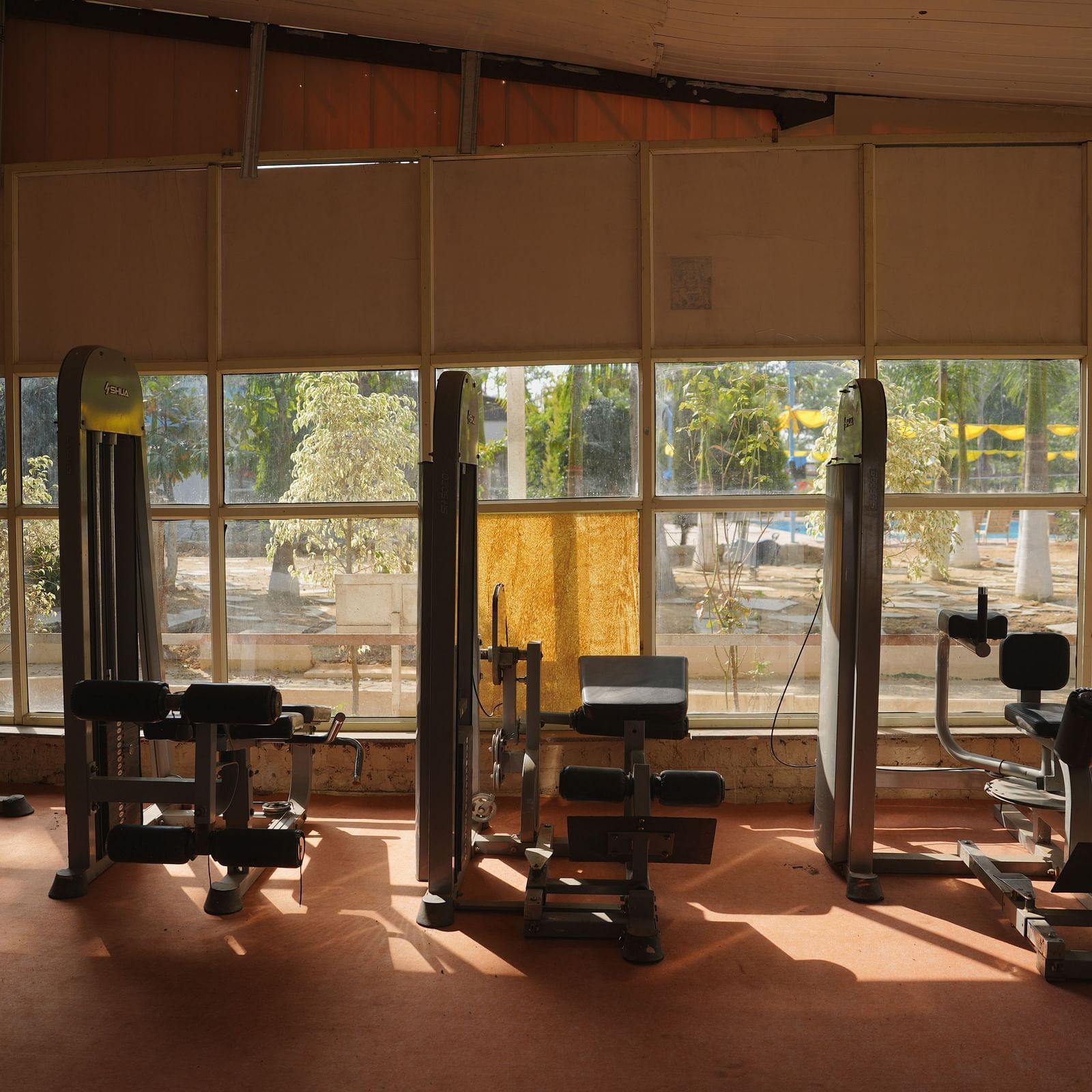 A well-equipped gym at The Meenakshi Resort by Welcome Inn Hospitality, Bangalore.