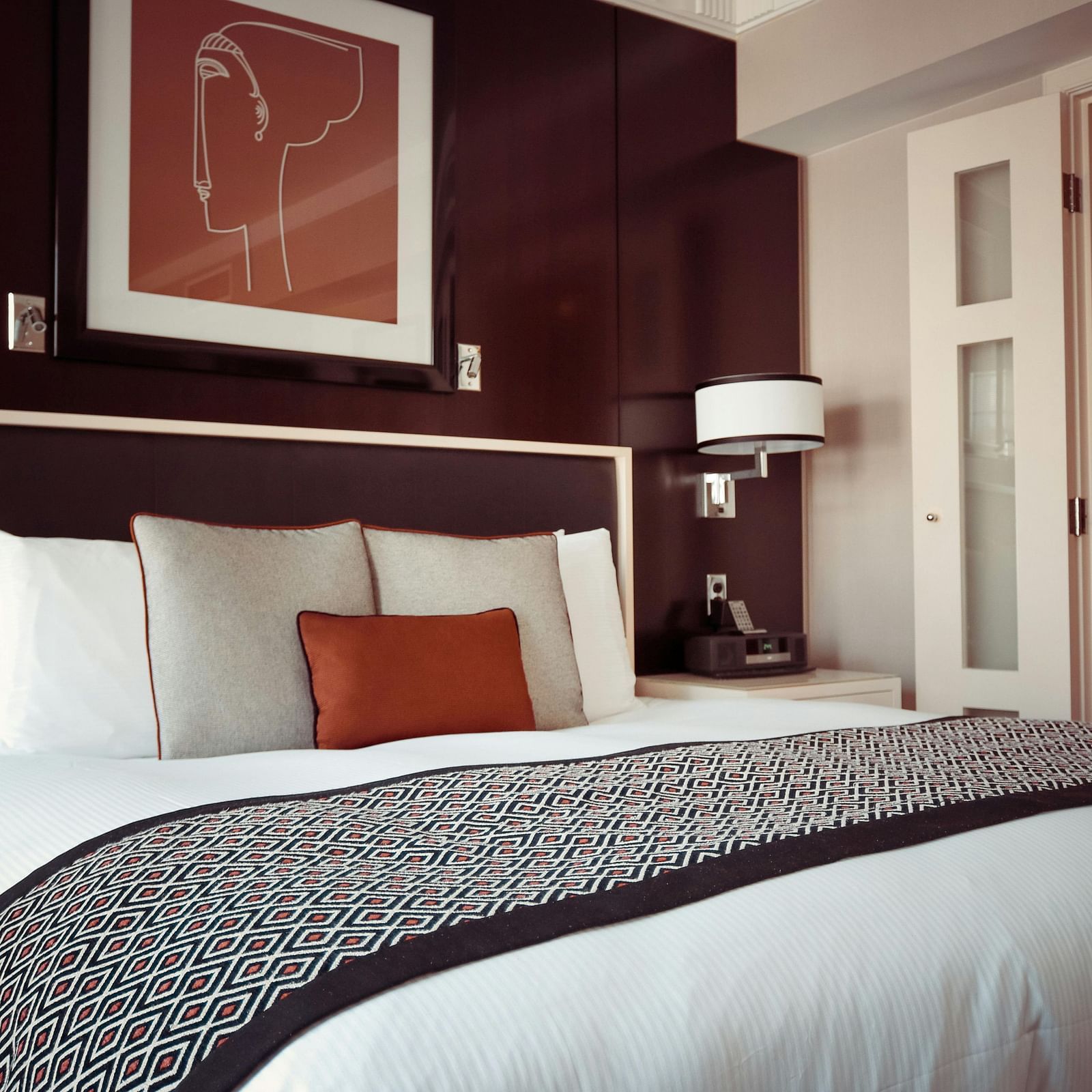 Spacious bed with neatly arranged pilllows