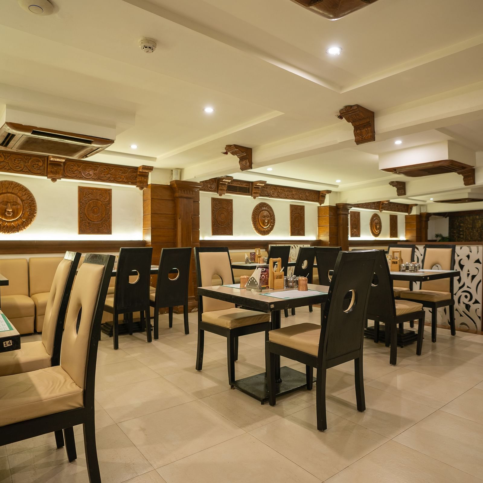 A  an image of the seating arrangement at the Andhra Ruchulu restuarant in The President Hotel, Hubli