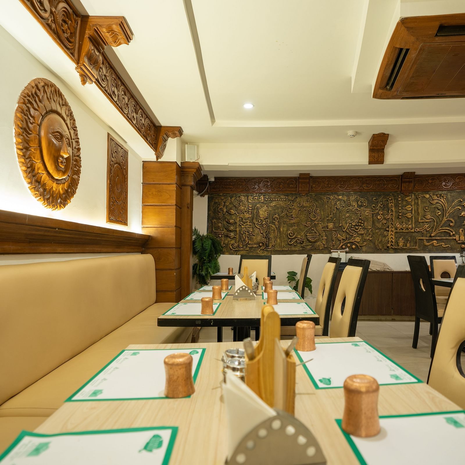 An image of a seating arrangement in a Restaurant at The President Hotel, Hubli