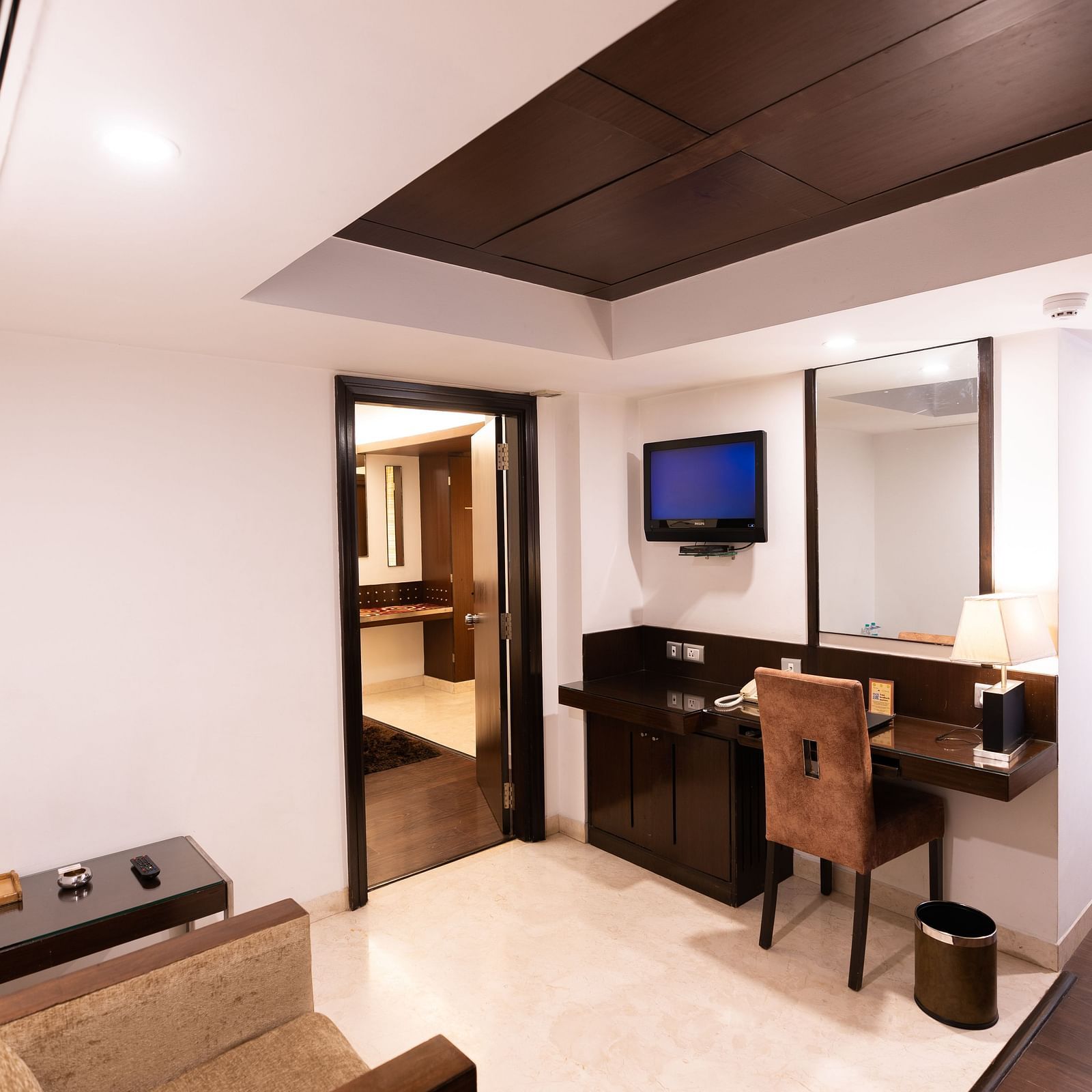 A view of the working desk in a room at The President Hotel Jayanagar, Bangalore