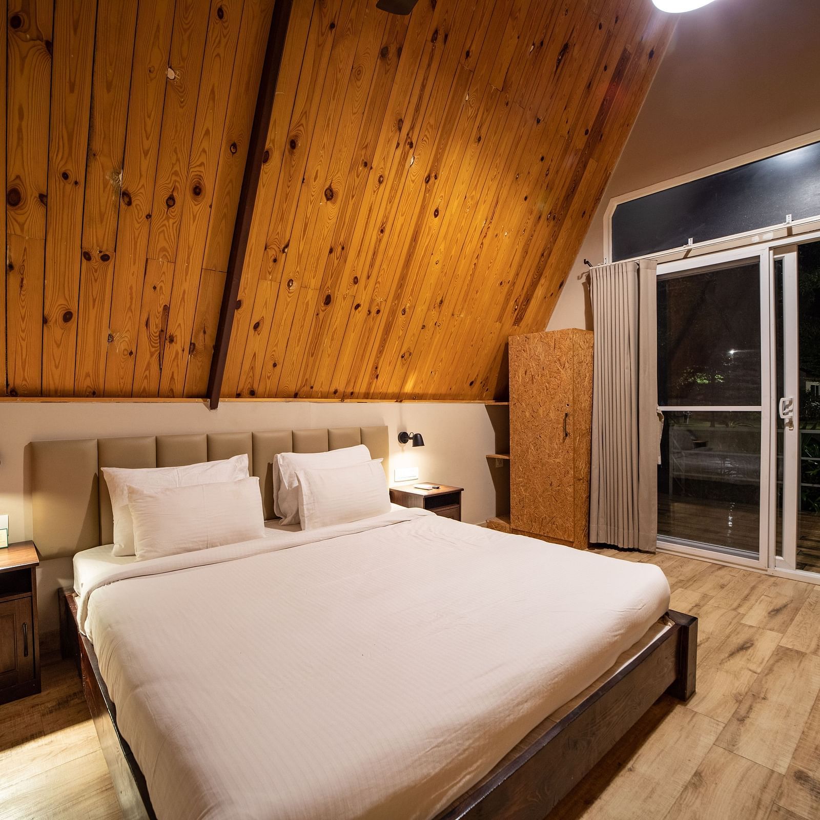 An image of a room with king size bed, bed side tables, cupboard - Trance Veechika Resort, Vikarabad