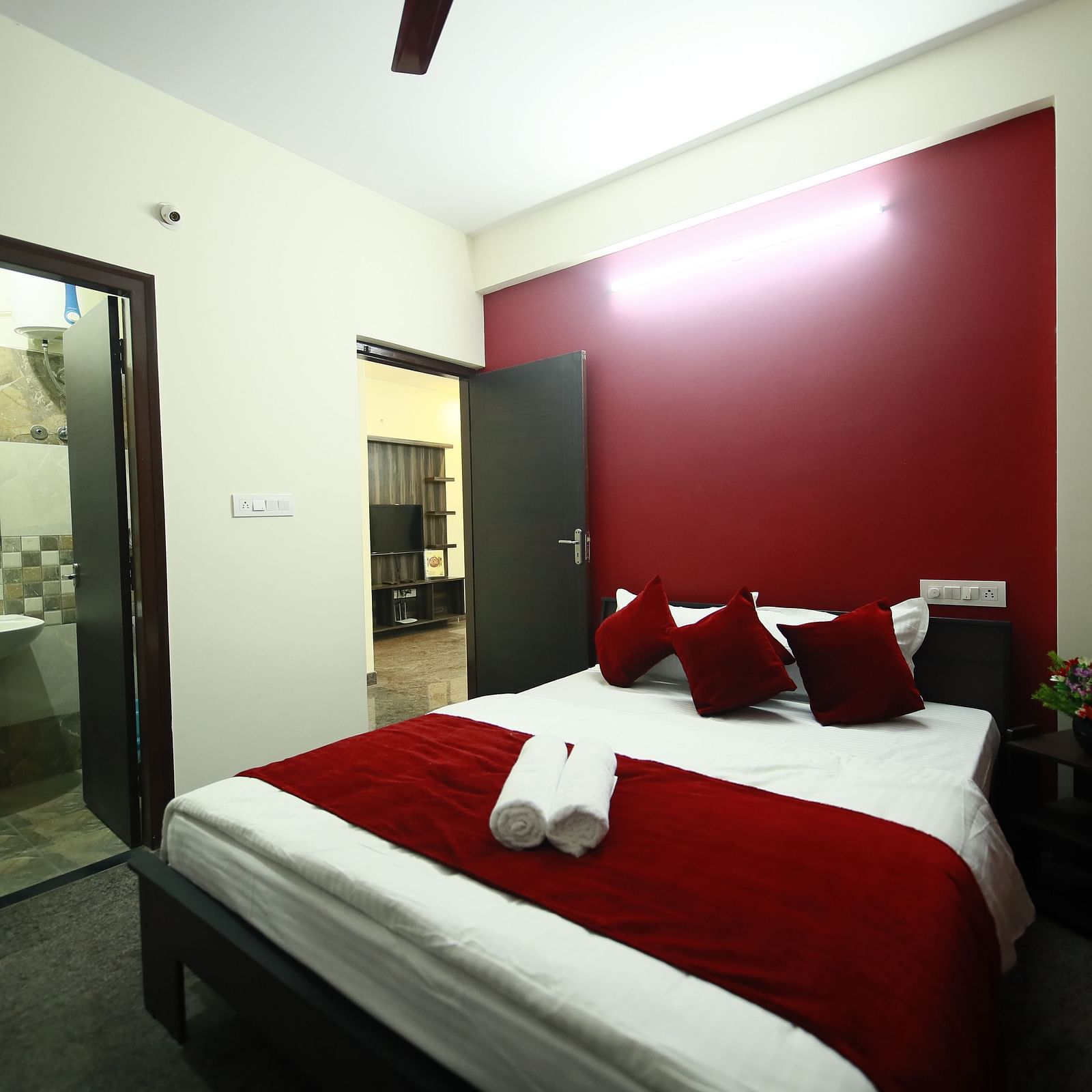 A queen size bed in a room at Tranquil ABS Orchid Serviced Apartments
