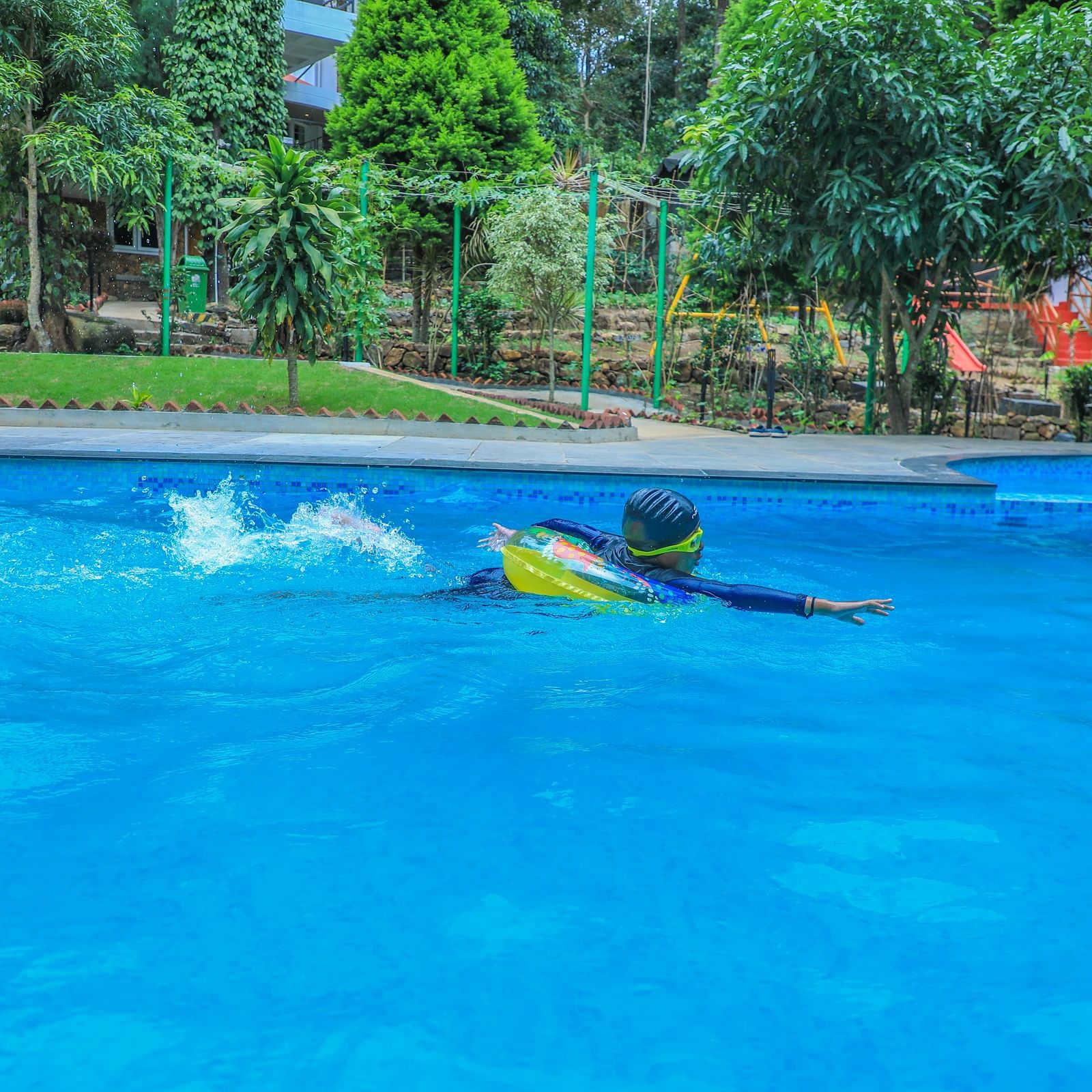 Image of a person swimming in the pool at WOW Bison Woods.