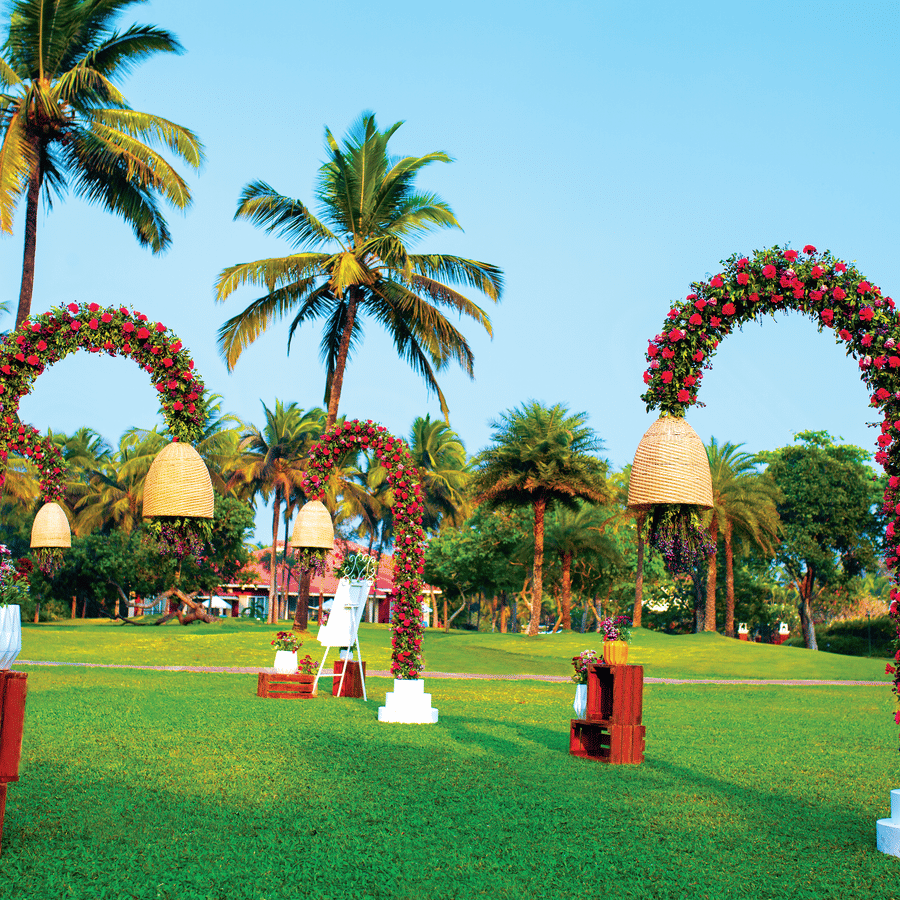 an overview of the lawn area with decorated lamp post - Caravela Beach Resort Goa