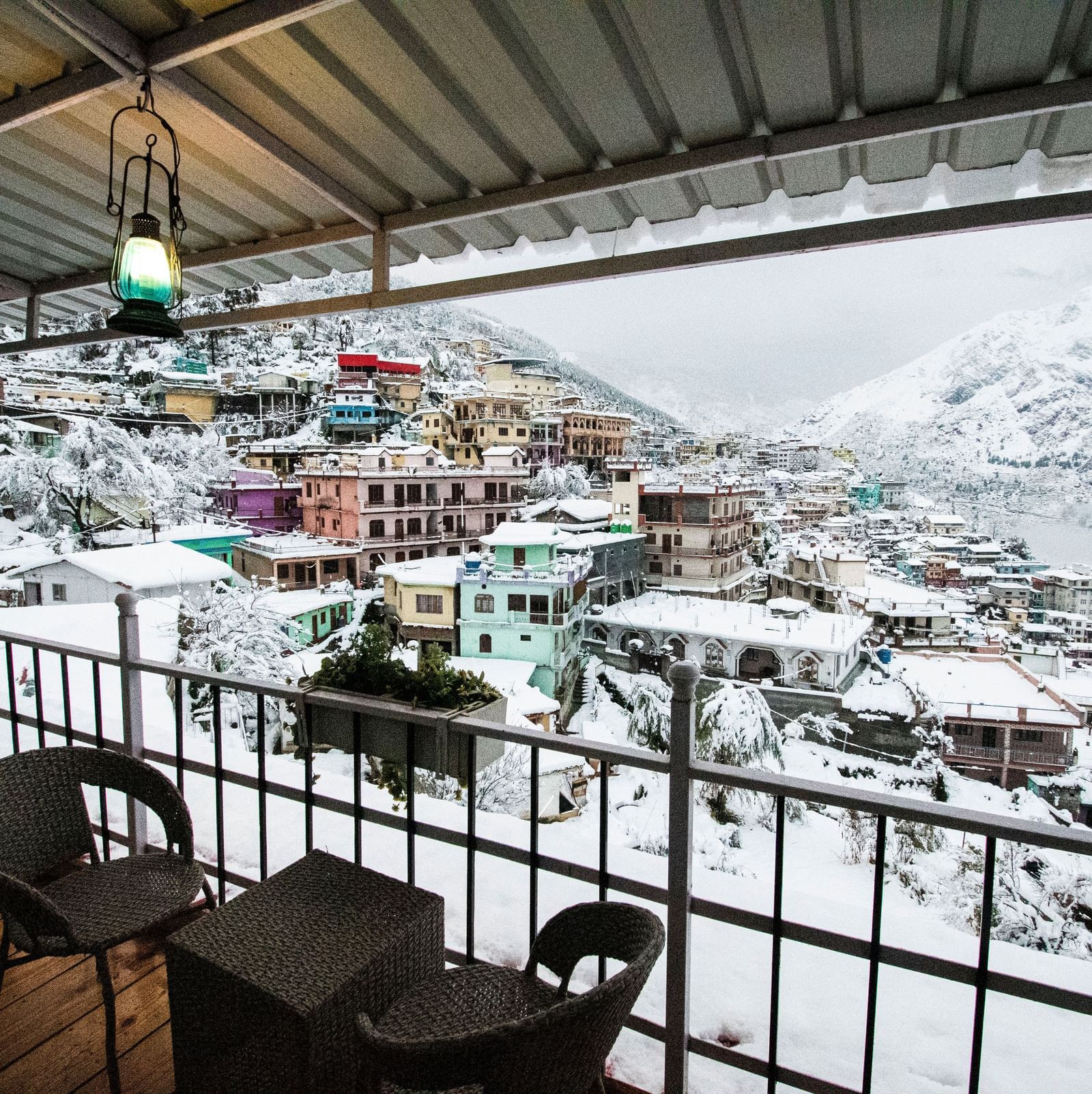 image of the city views on a snowy day with a think blanket of white snow covering everything - The Tattva, Joshimath