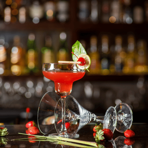 a glass of liquor kept on a bar counter - polo floatel kolkata