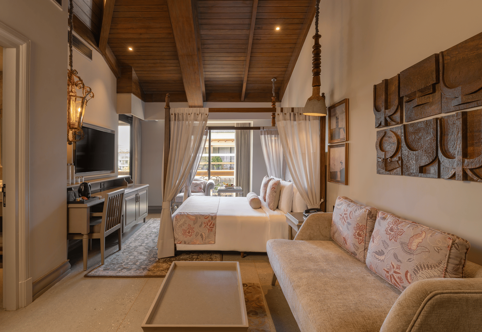 Side view of the Executive Room featuring a wooden ceiling and elegant furnishings at The Evren, Vagator.