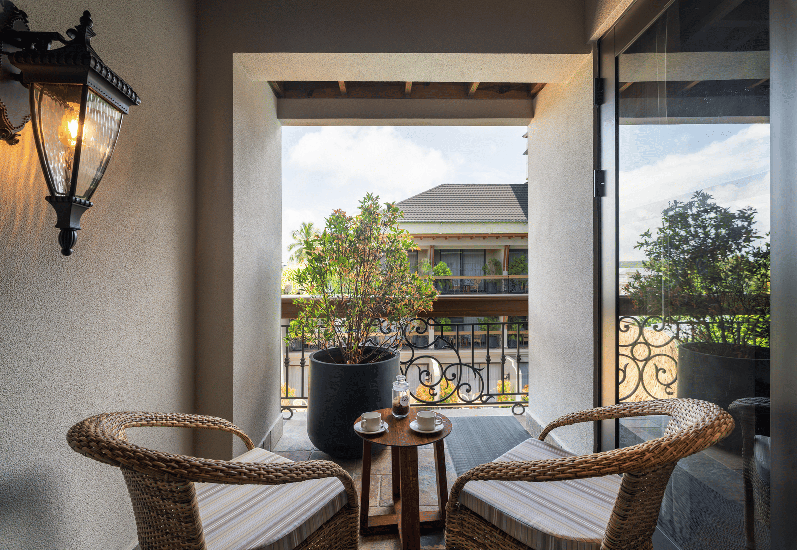 2 arm chairs kept on the balcony of the Executive Room along with a small coffee table at The Evren, Vagator.