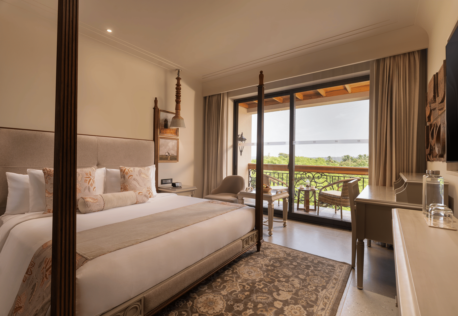 A corner-view shot of the Classic Room (Diwa) featuring a double bed along with a patterned rug placed in front of it at The Evren, Vagator.