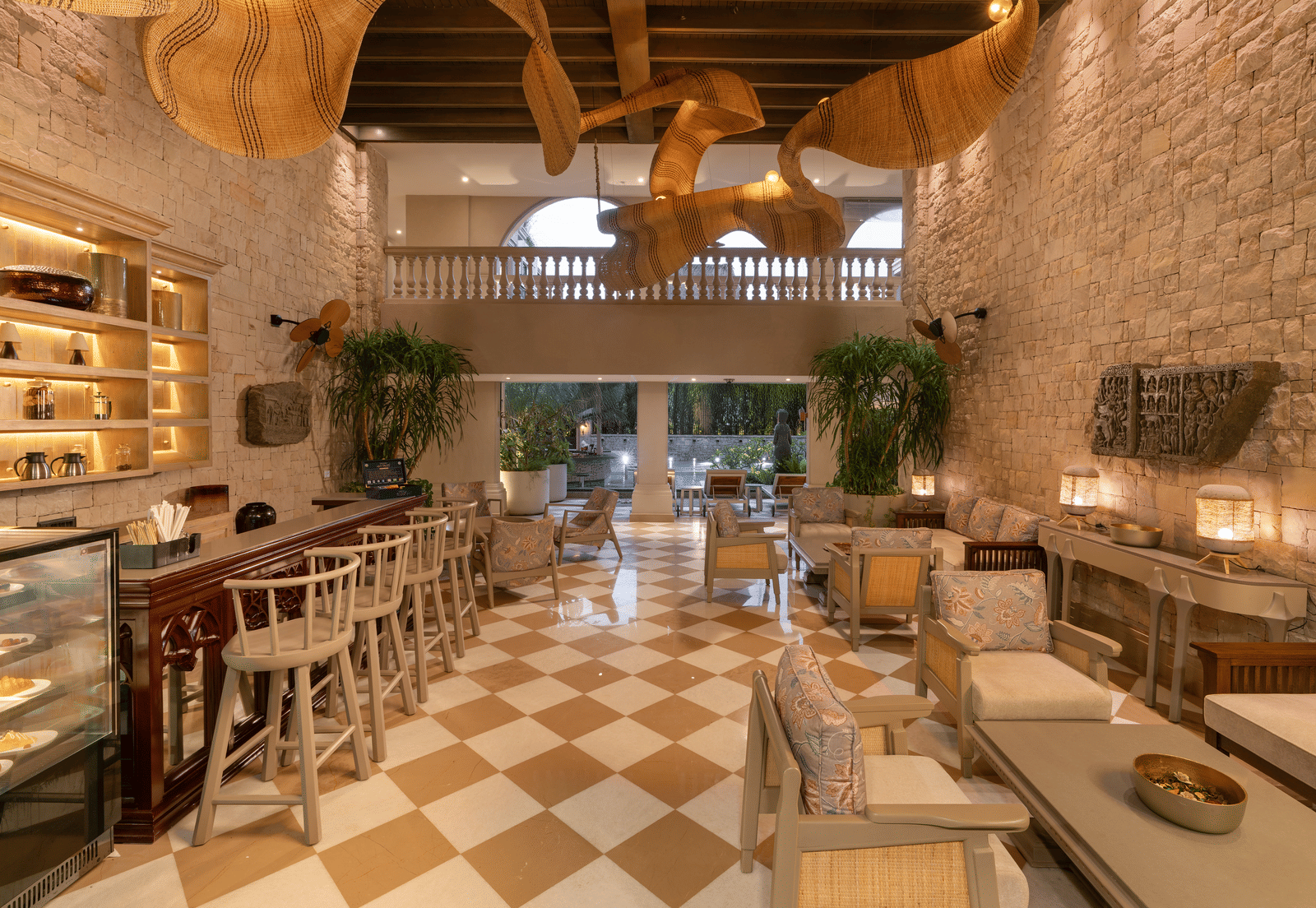 Full view of the Suenos de Cafe featuring a beautiful chandelier hanging from the ceiling.