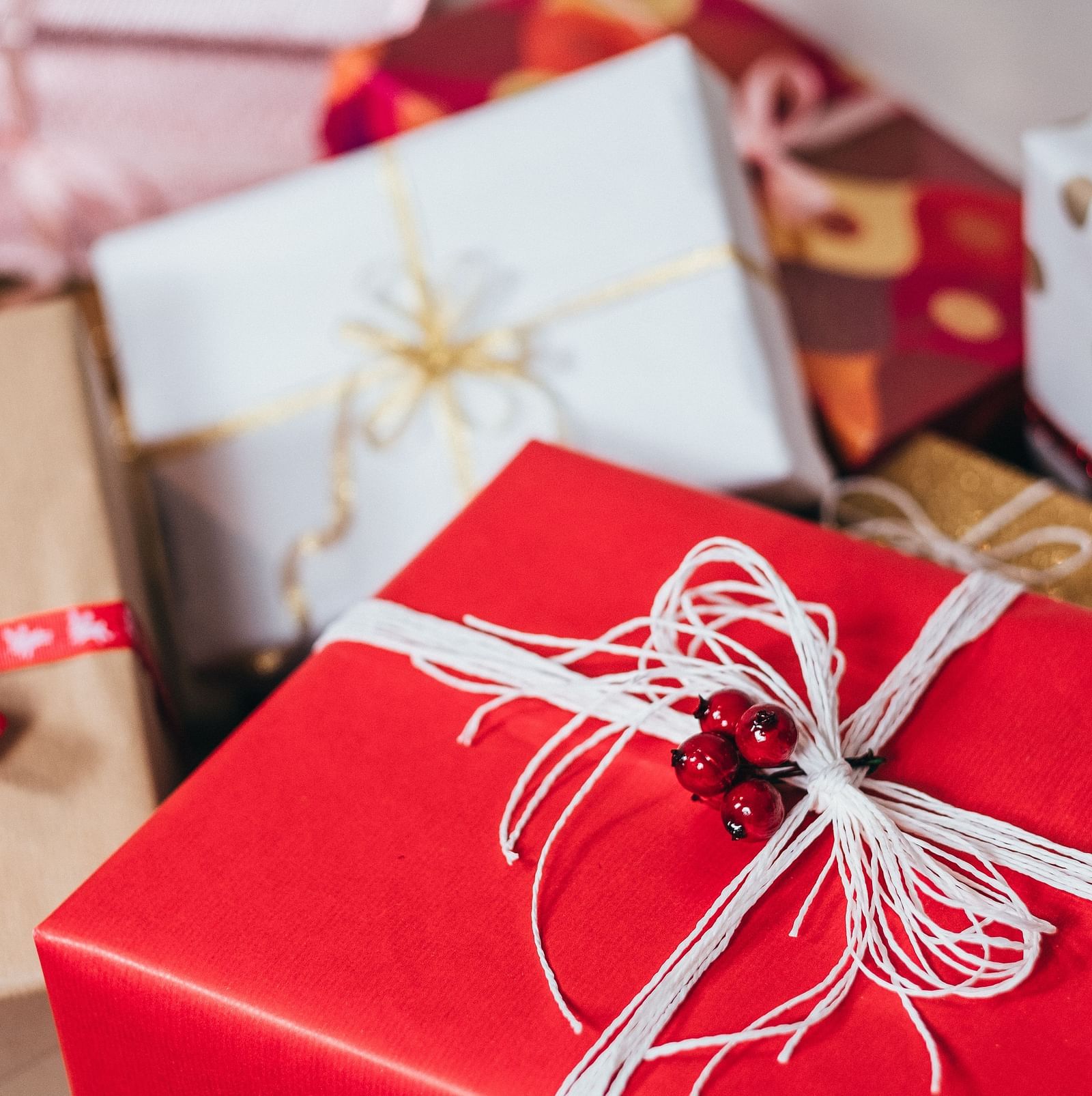 a close up shot of many gifts boxes with wrapping 