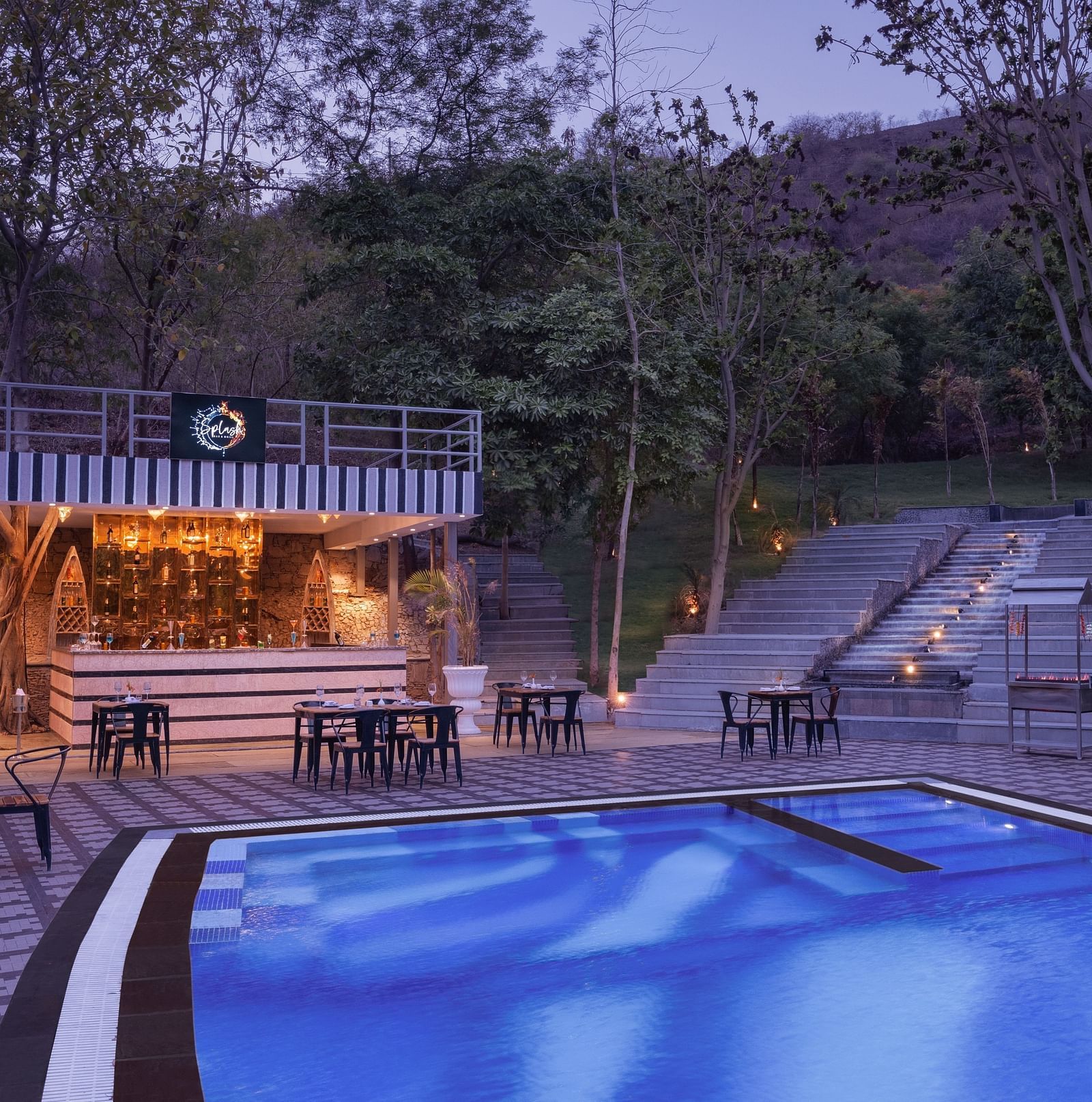 A swimming pool view at evening at Essentia Luxury Resort & Spa, Udaipur.