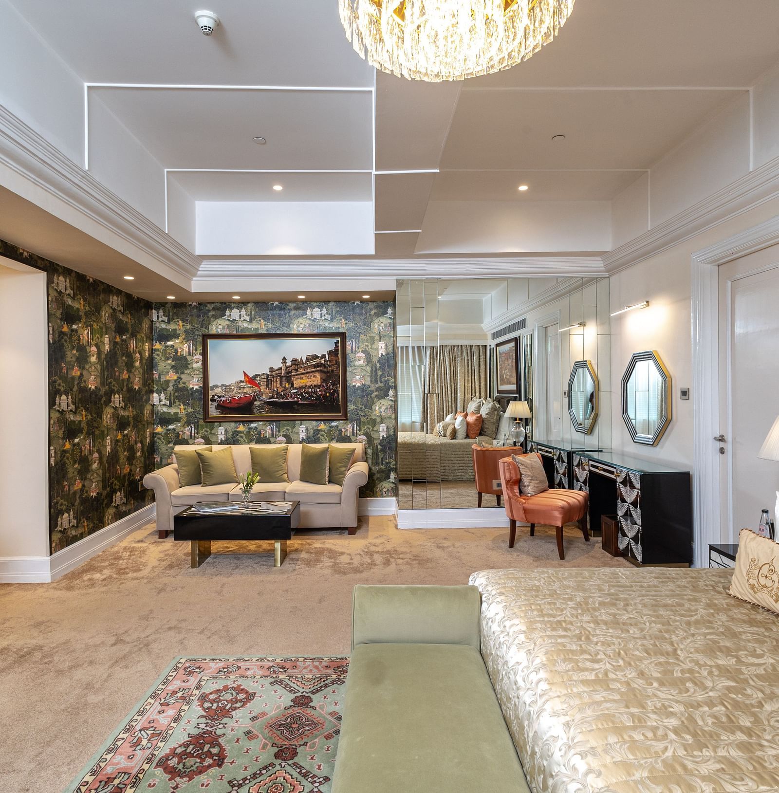 Presidential Suite at The Claridges New Delhi, featuring a spacious room with a cosy couch and elegant ambient lighting