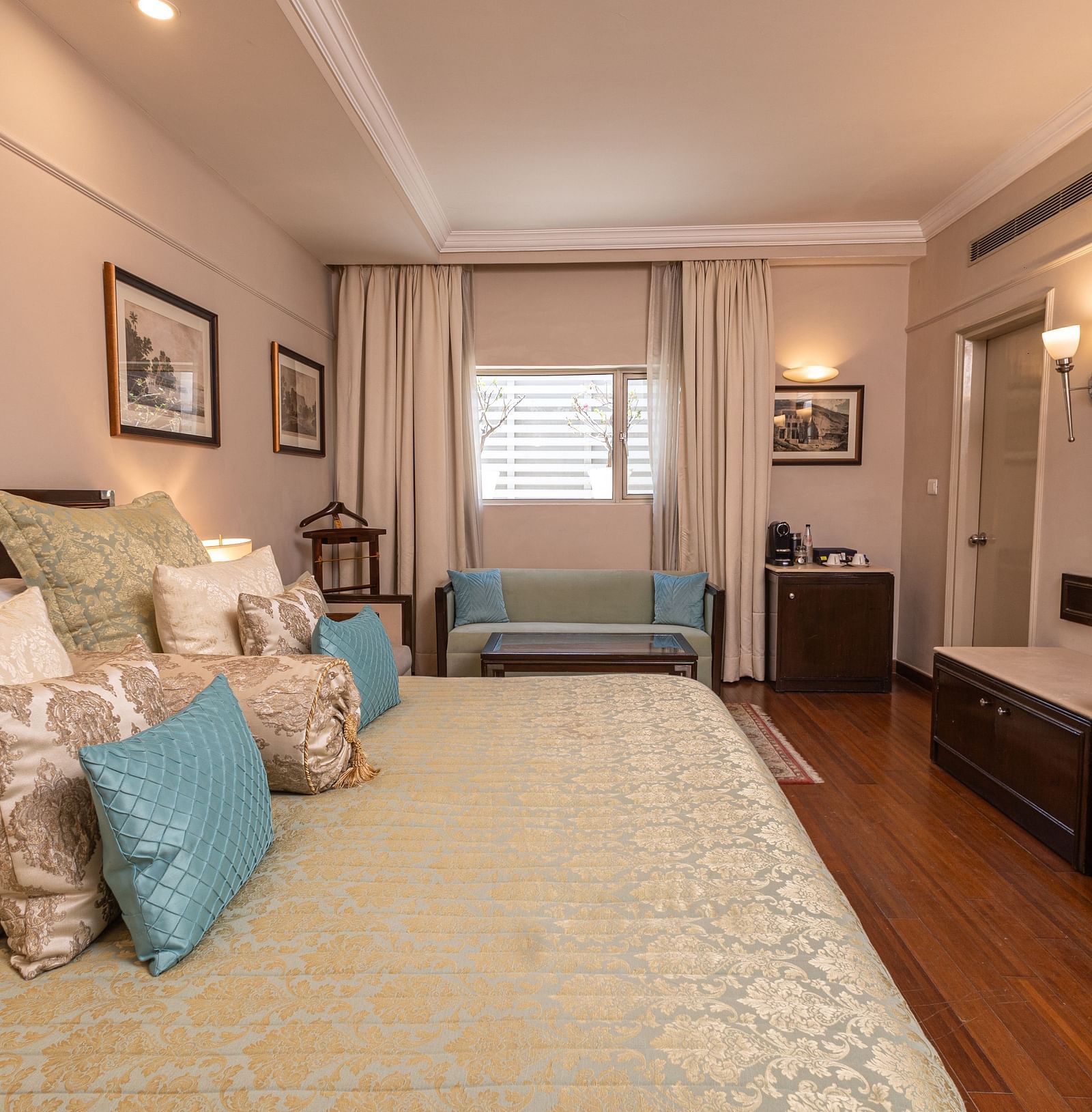 image of a spacious bedroom with a king size bed at our boutique rooms - The Claridges New Delhi