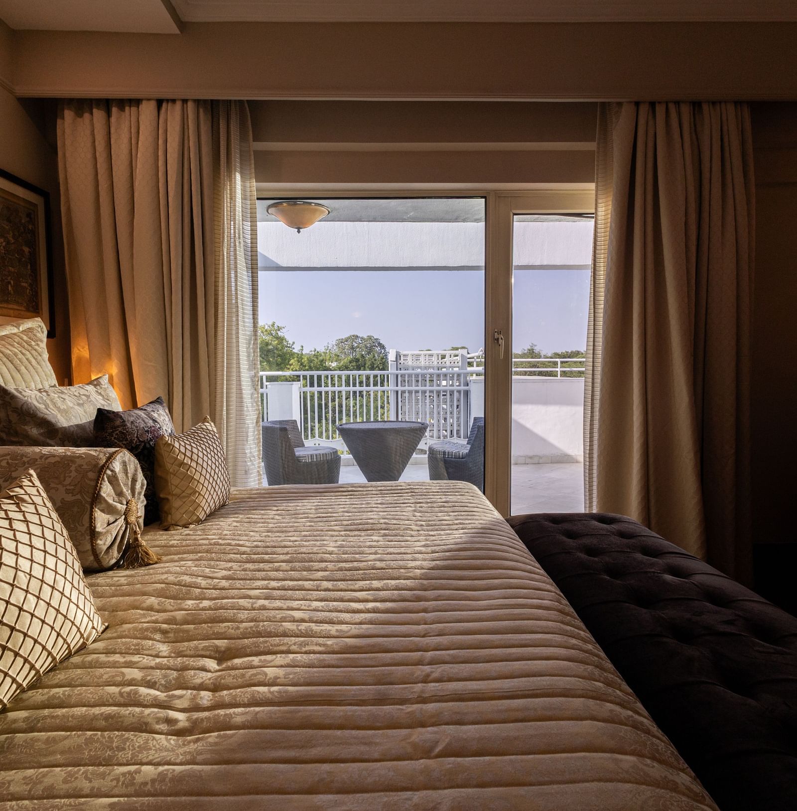 a beautiful image of the of heritage terrace room with natural light coming from the french windows - The Claridges New Delhi