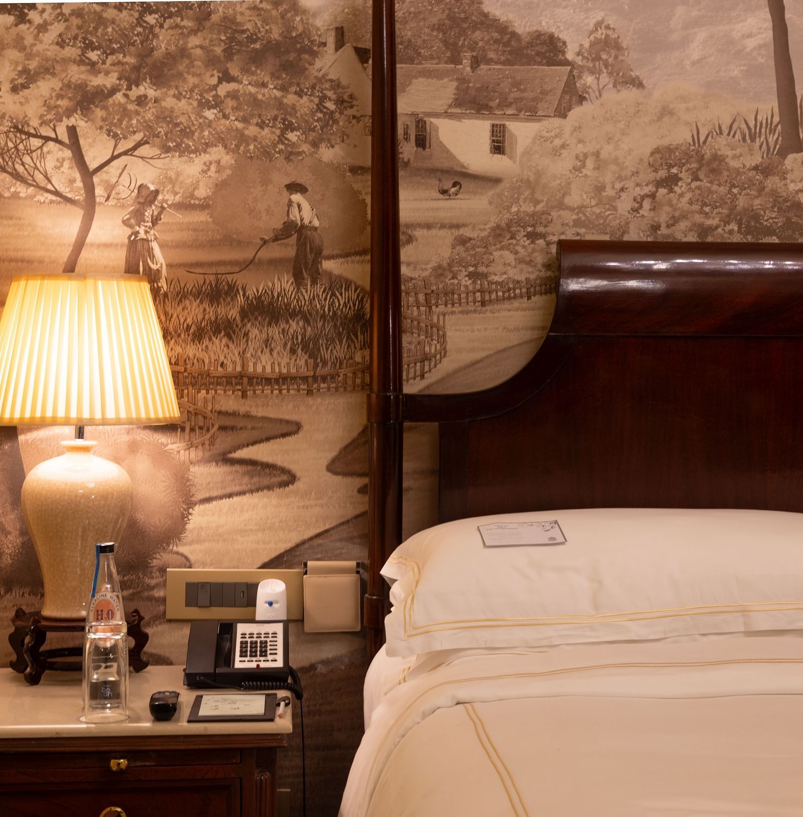 closeup image of the side table of our heritage room with a table lamp - The Claridges New Delhi