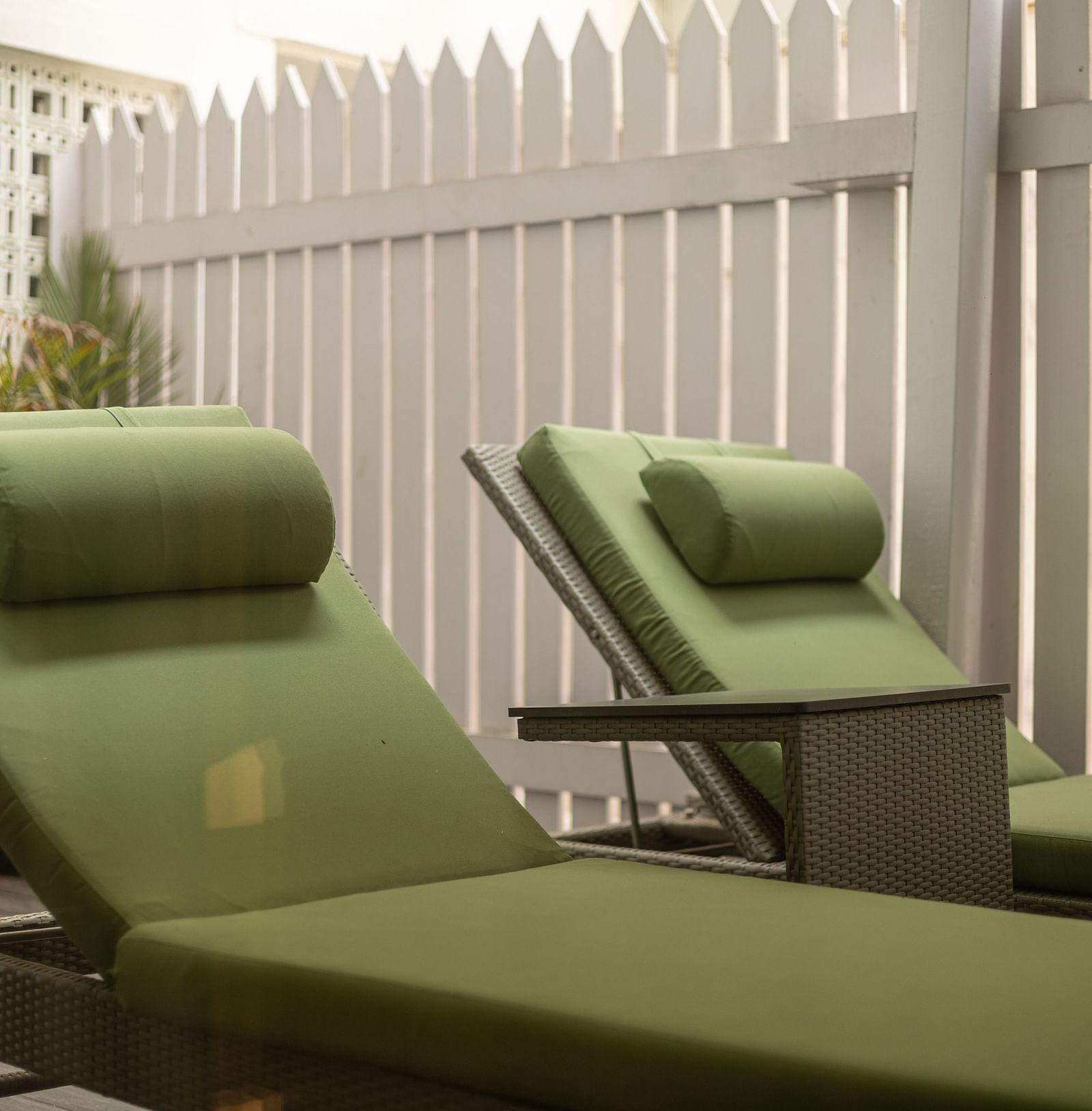 image of the green coloured sun loungers at our heritage luxury suite - The Claridges New Delhi