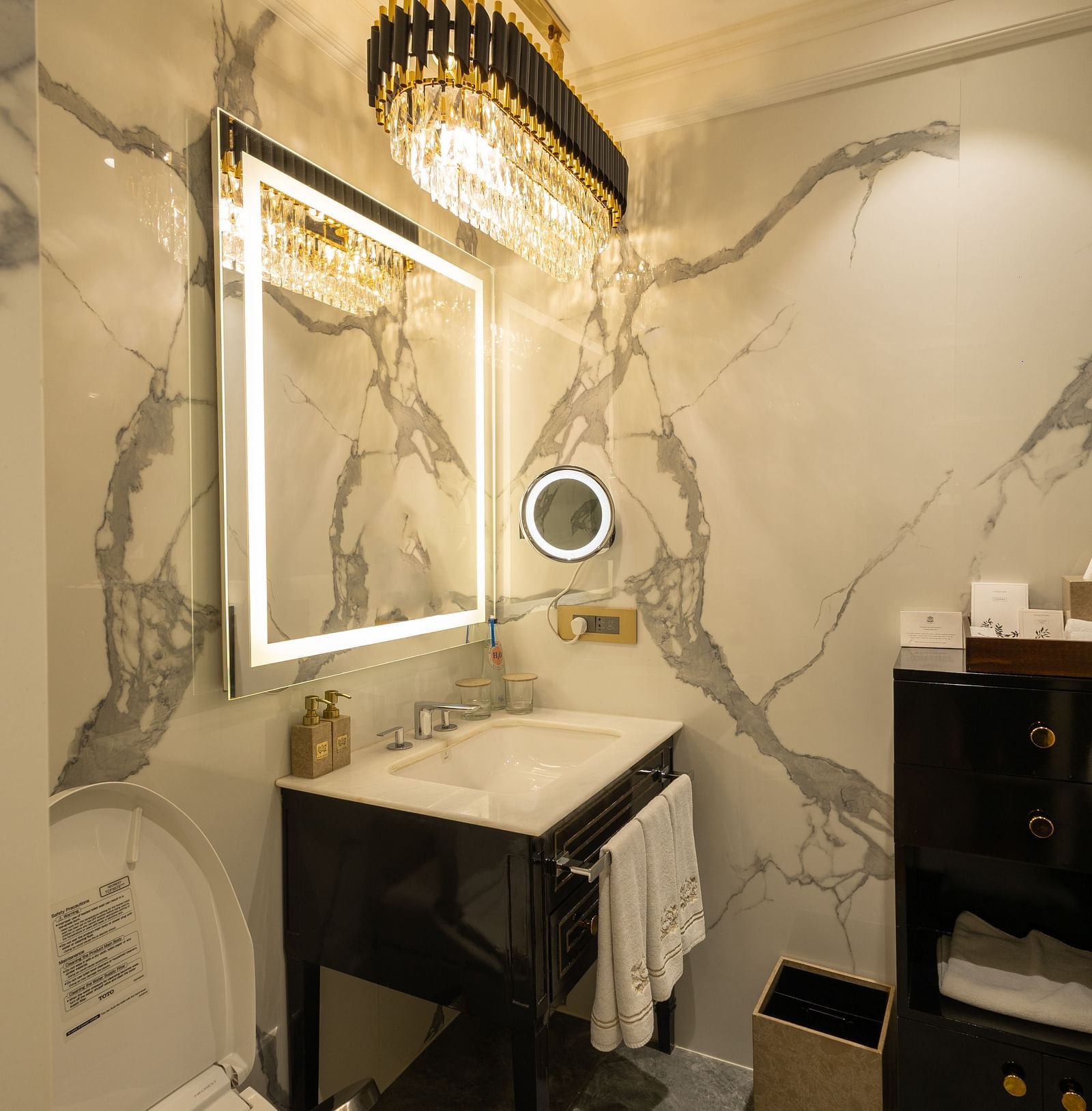 Superior Room washroom at The Claridges New Delhi, featuring a sleek sink and a wall-mounted mirror
