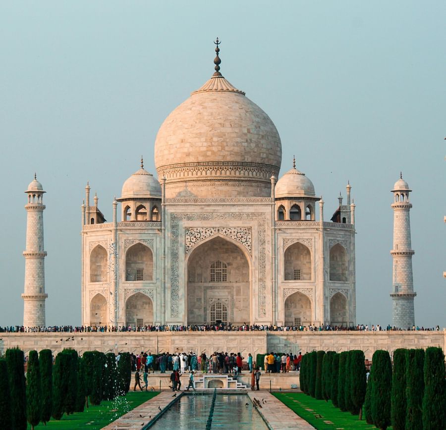 A stunning view of the Taj Mahal, a white marble mausoleum in Agra, India