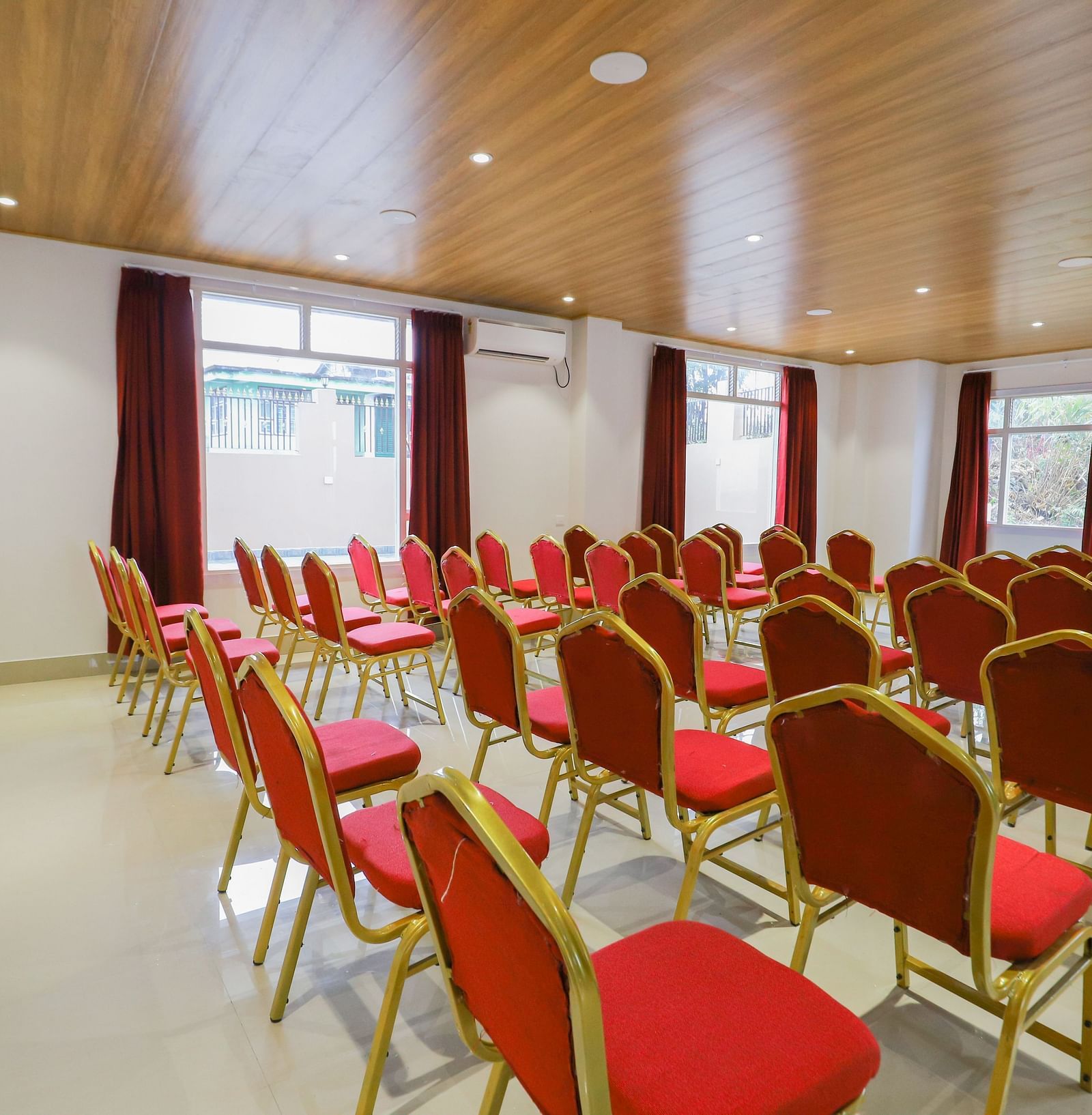 event setting with red chairs at Banari Regency by Summit, Namchi