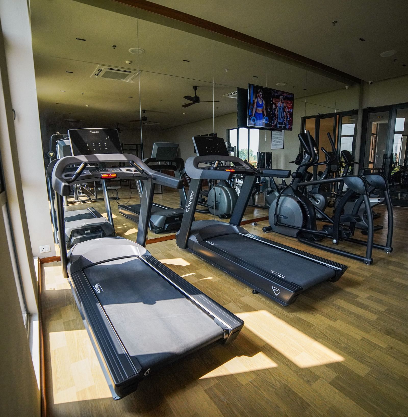 Treadmills and other cardio equipment placed in the indoor gym at Singalila Club