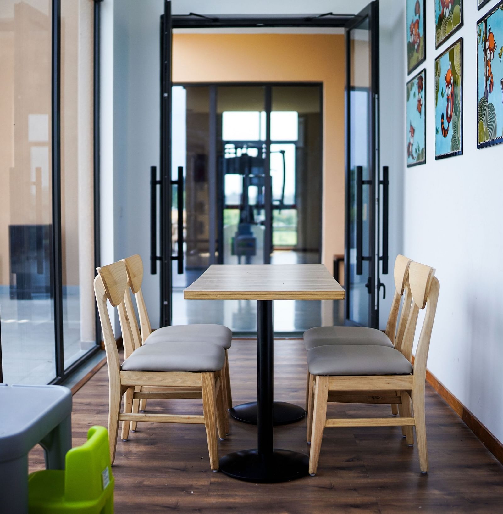 Kids play area at Singalila Club with large French windows letting in light during the day